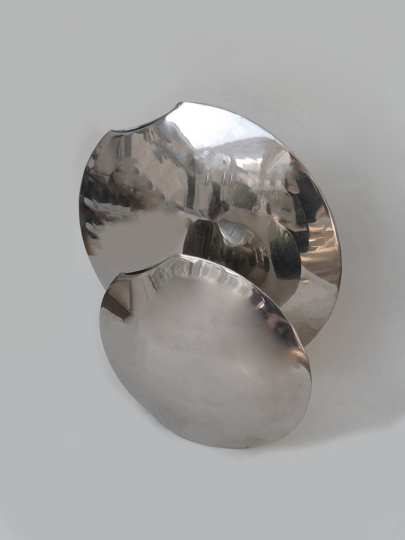 Pair of Round Vases by Les Objoies | The Oblist — polished metal finish
