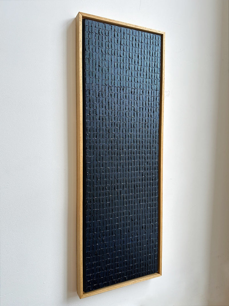Prussian blue textured painting detail in natural wood frame