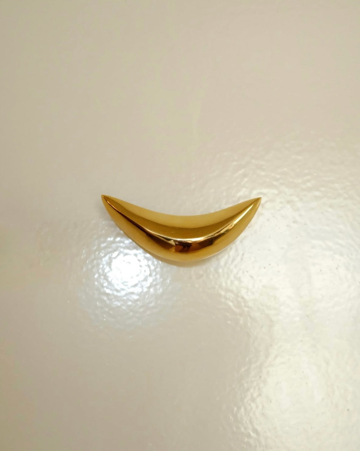PETAL Knob/Hook — close-up of shiny gold surface
