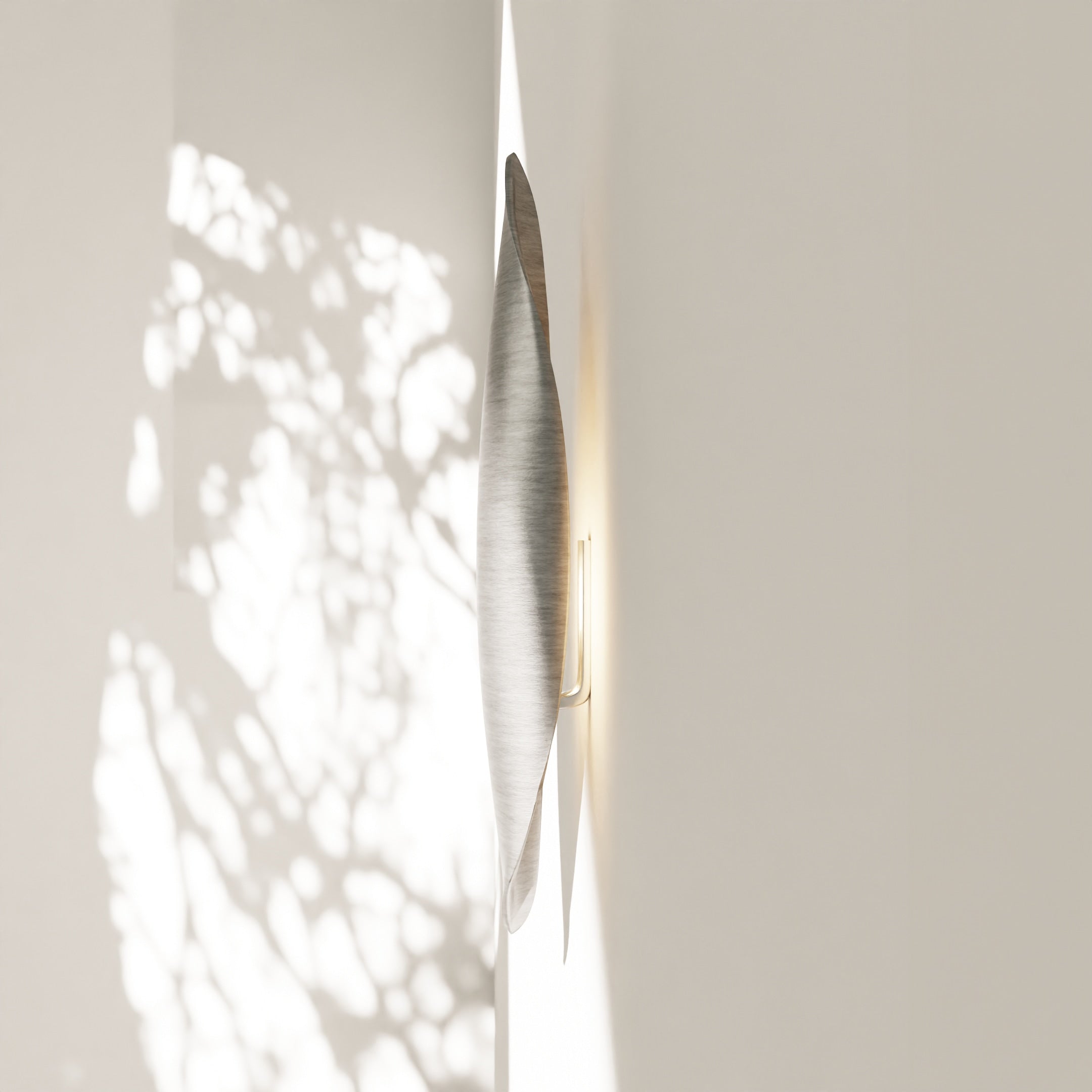 Plume Applique | Aluminum — side view against light wall