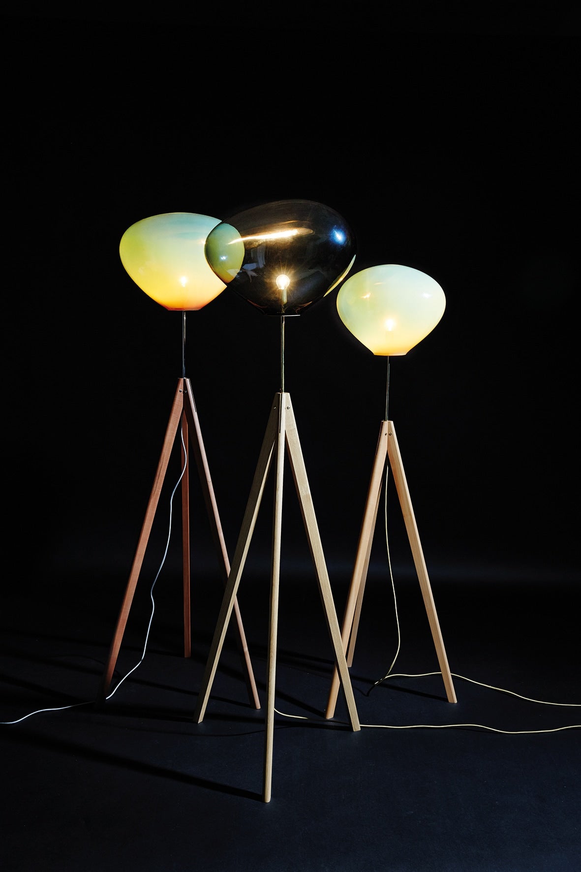 STATIX Floor Lamp — side angle showing wooden legs and glass shades