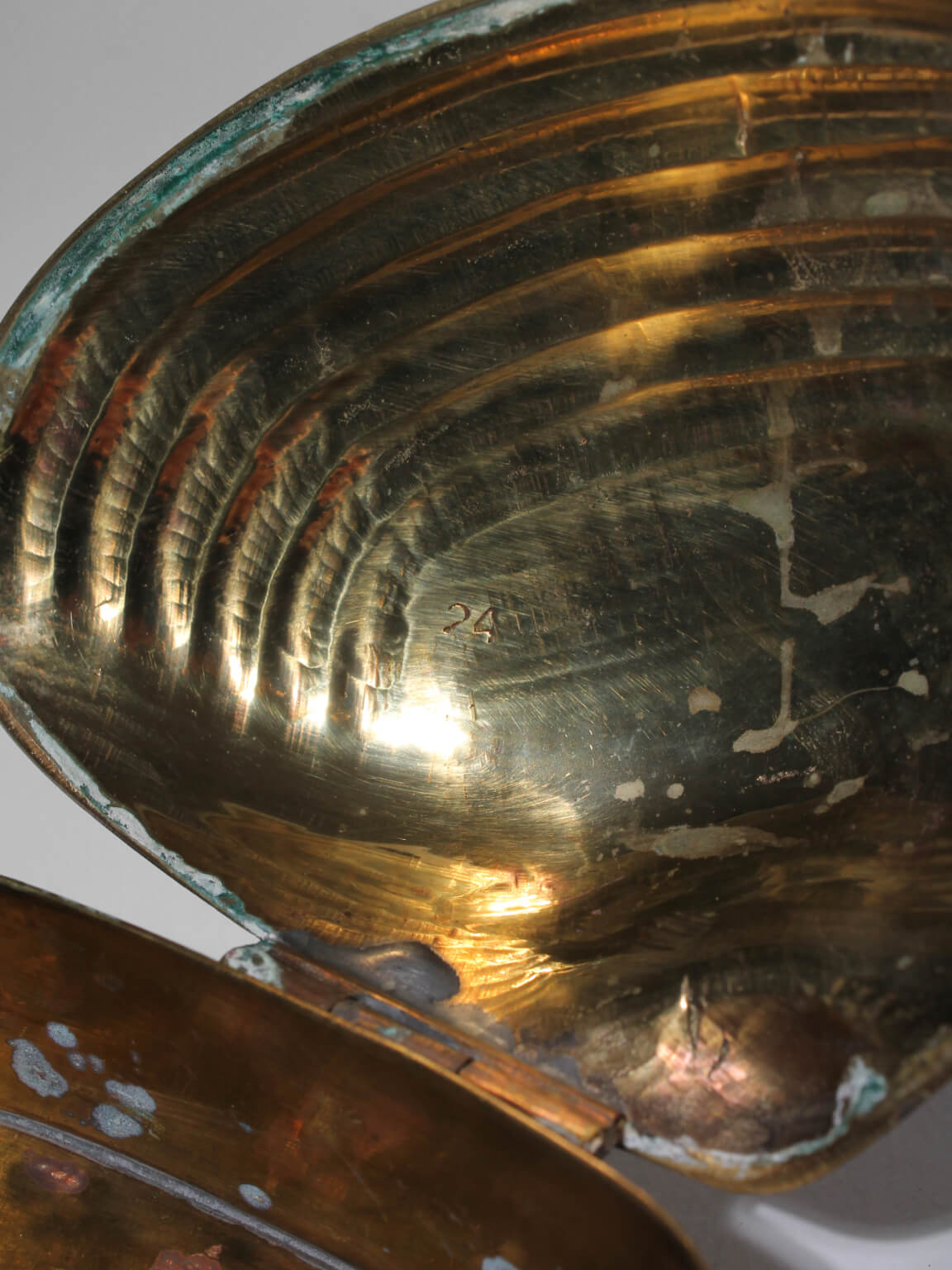 Brass Clamshell Trinket Box — side angle showing interior brass texture