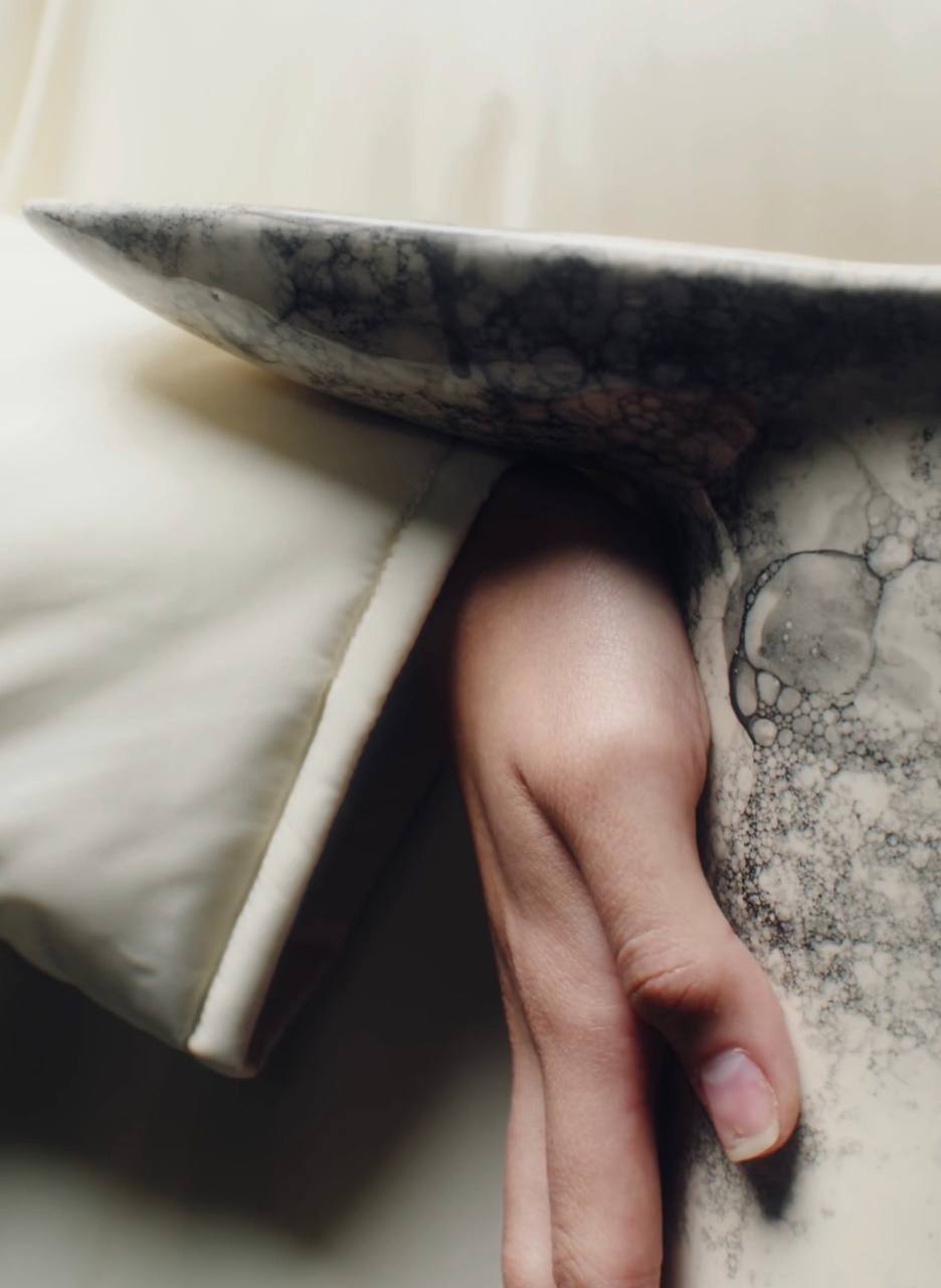 Dyka Ceramic Vase — close-up of hand holding marbled ceramic surface