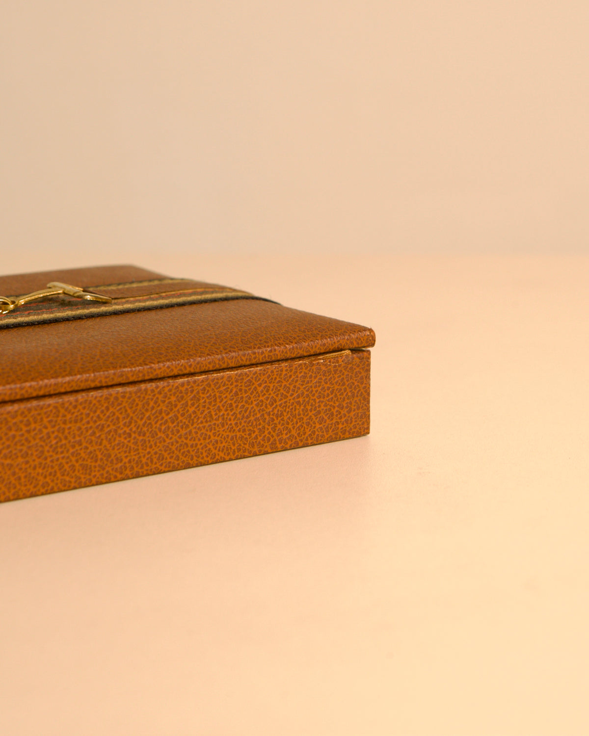 French brown leather box in the style of Hermès, 1960s — lifestyle setting