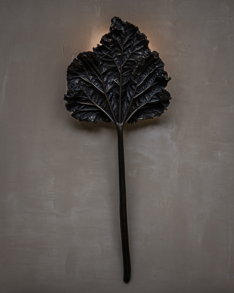 Bronze rhubarb leaf wall light detail showing textured surface