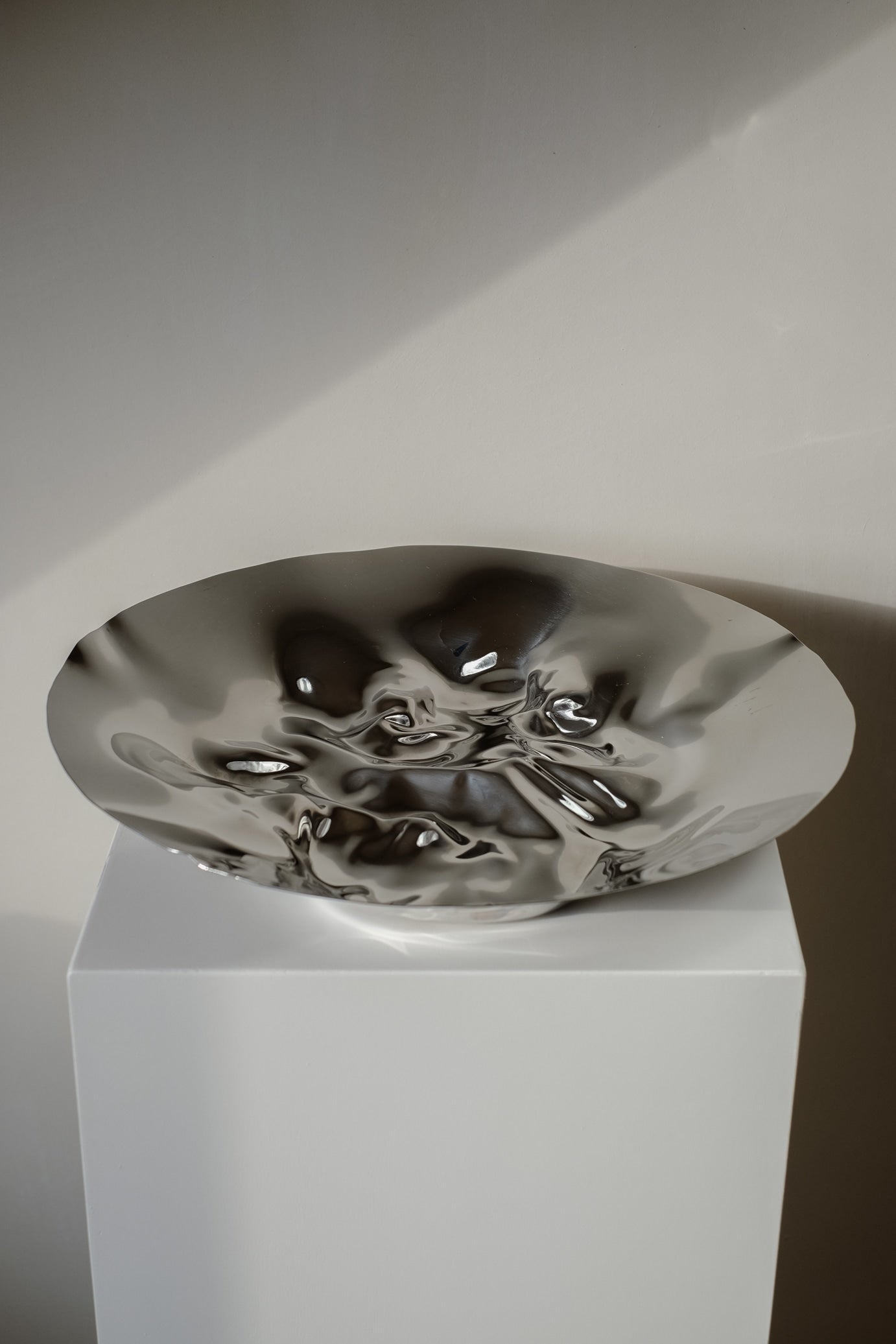 Chrome Curved Decorative Bowl — back view of polished chrome surface
