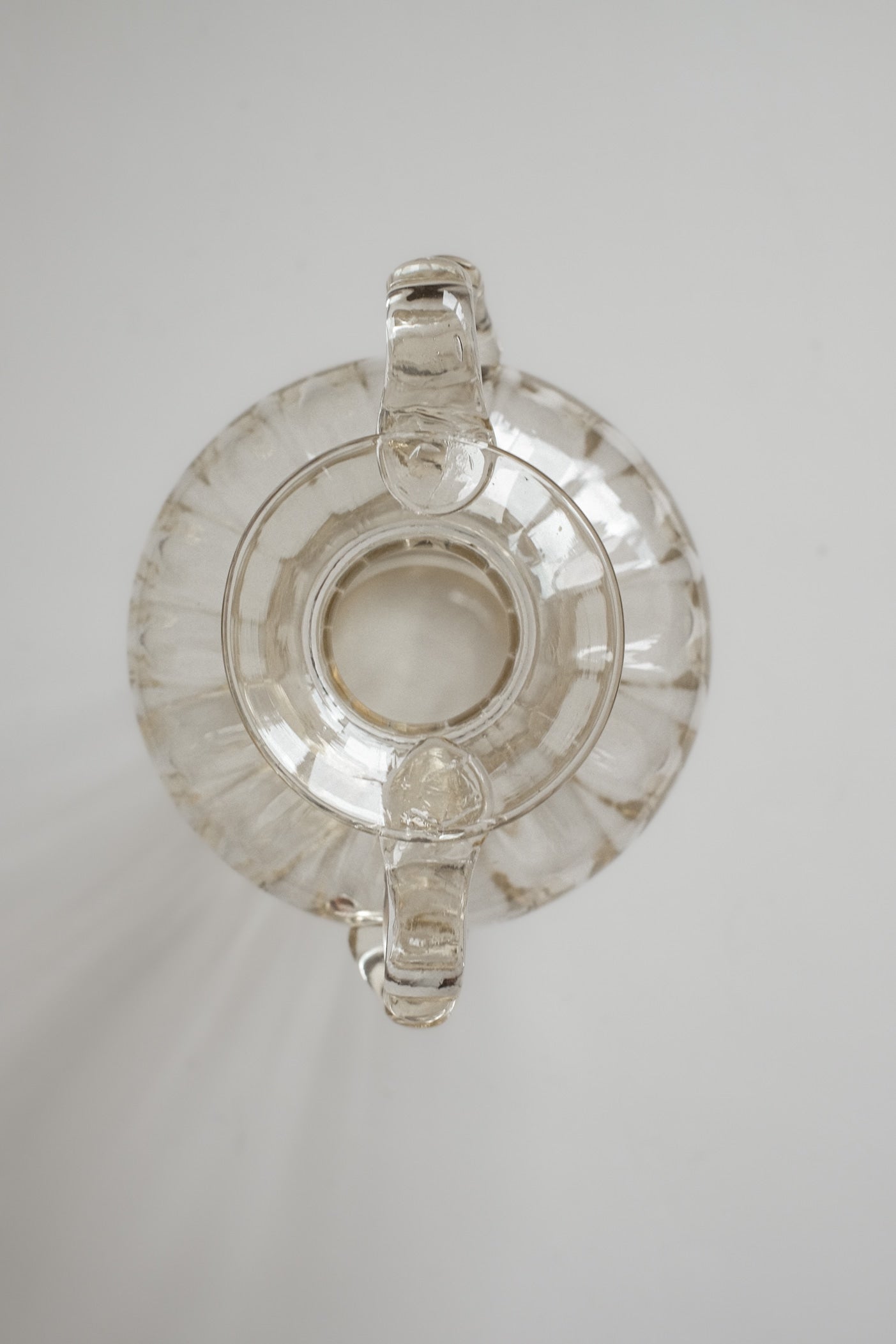 Elegant Handcrafted Glass Vase with Decorative Handles — in context