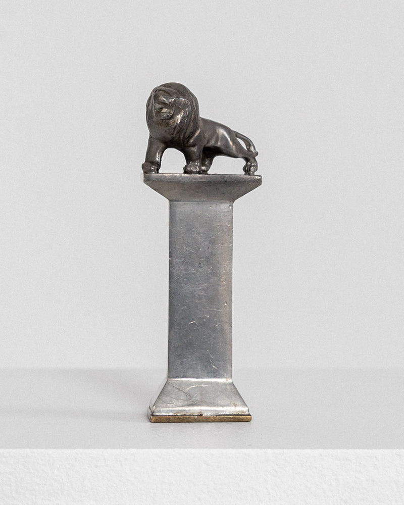 Art Deco pewter seal stamp with lion sculpture on marble column