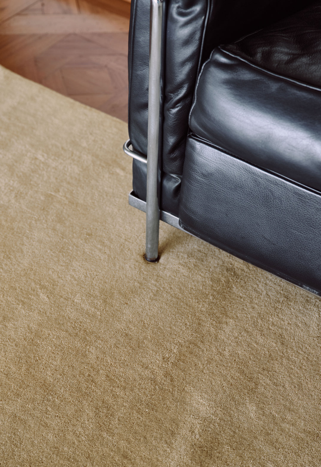 'Solid Wool' Handwoven rug, Soft Yellow — side angle