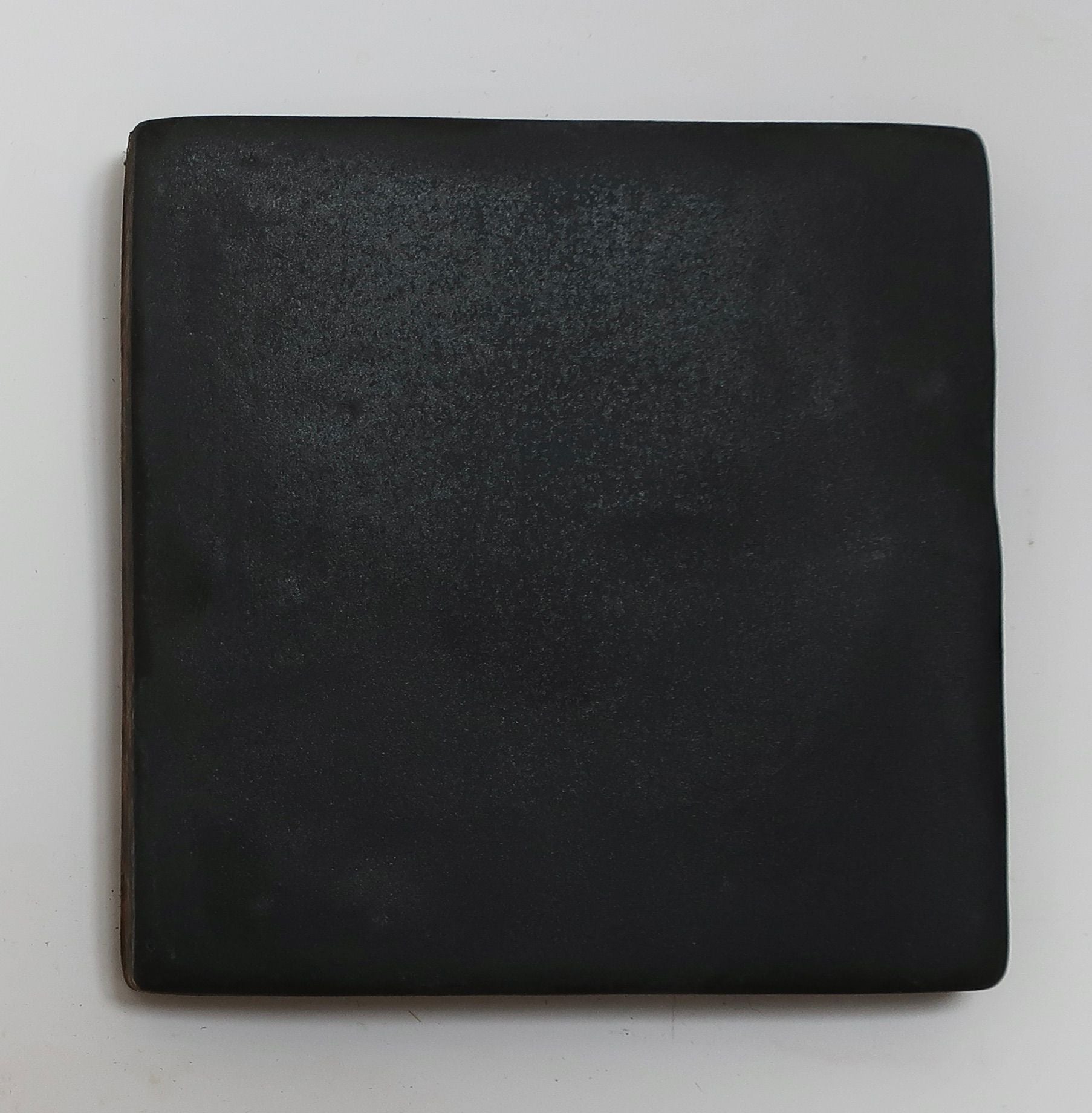 Square black mirror with matte finish by ORRE Studio