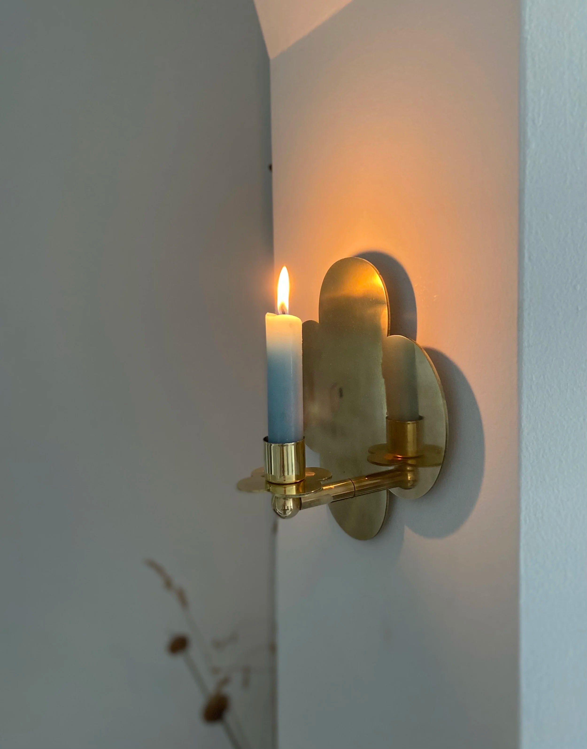 Quatrefoil Candle Sconce D:2023 — side view on wall with candle