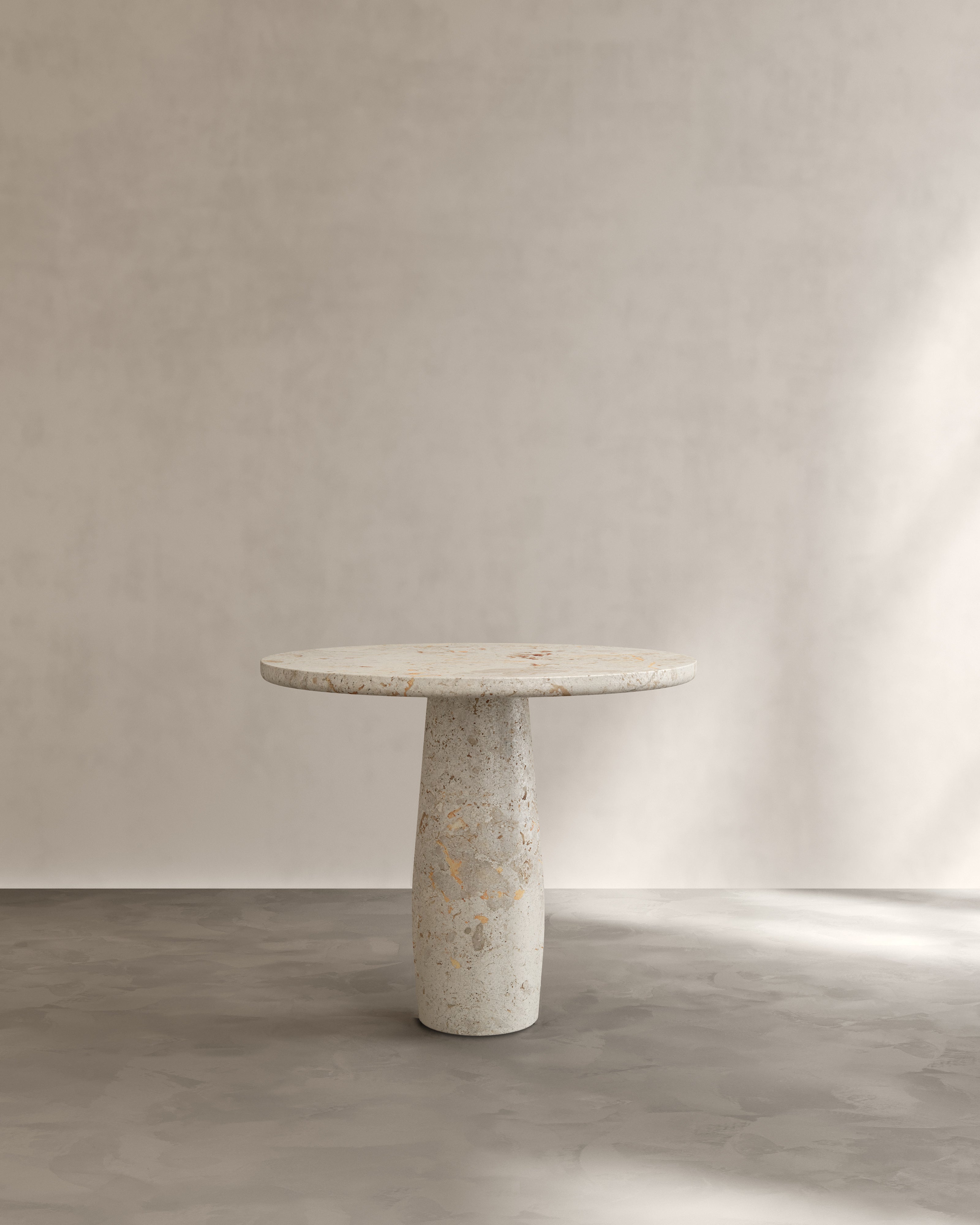 Raffaella Table I — front view of round stone dining table