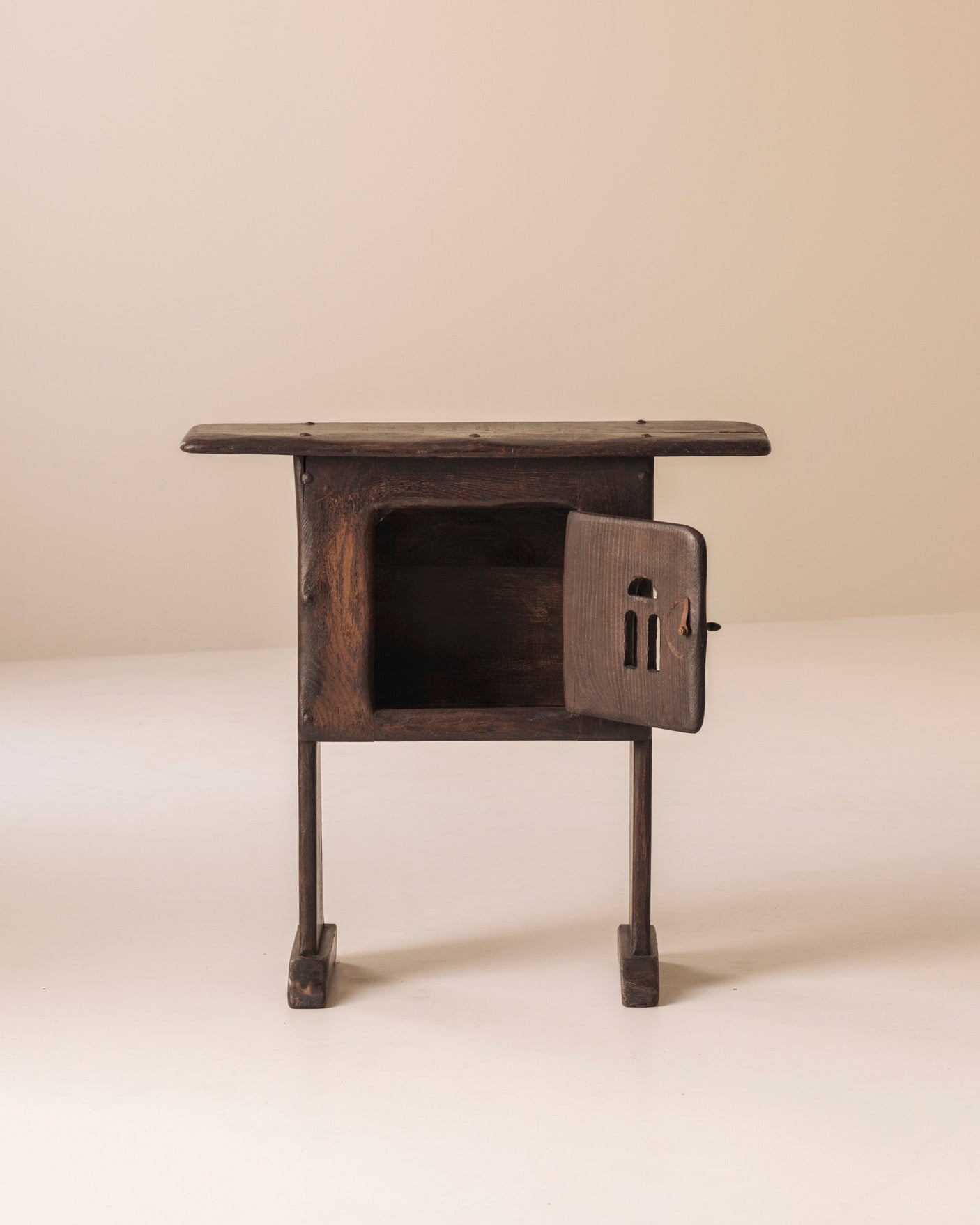 Early 20th century Folk art rustic cabinet / side table from France — lifestyle setting
