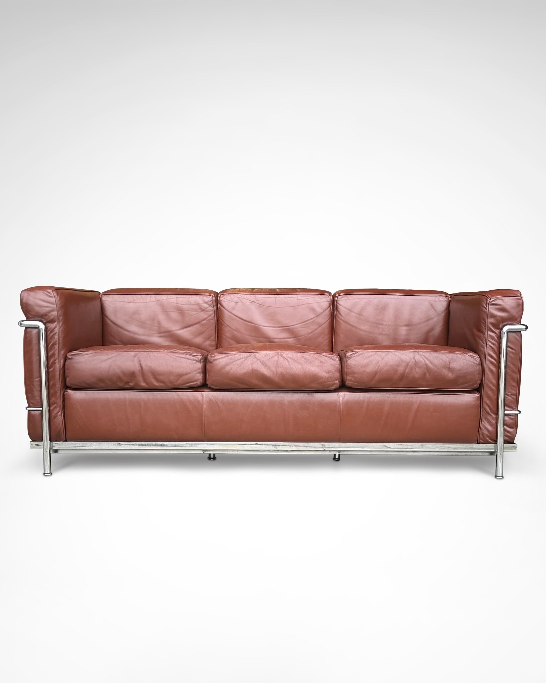 Early production LC2 leather 3-seater sofa by Le Corbusier et al Cassina 1970s by Redesignable | The Oblist — brown leather,