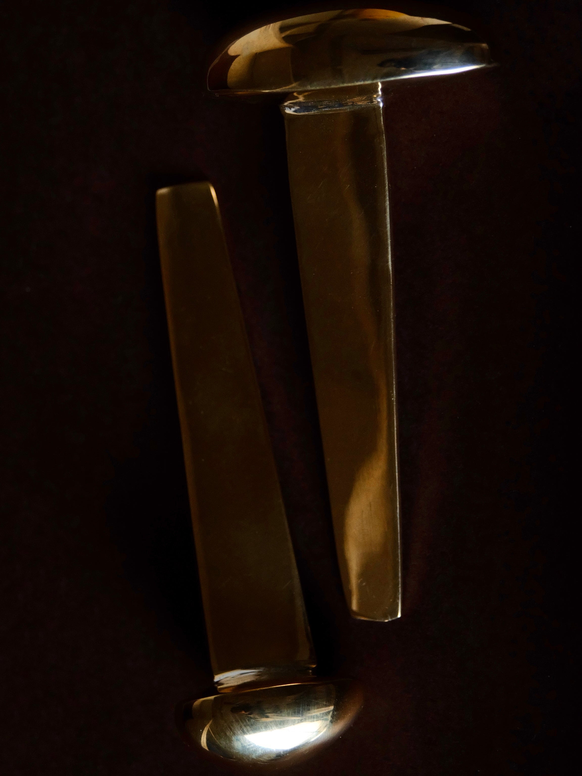MOMI Bookmark No. 1 — top view of polished brass design