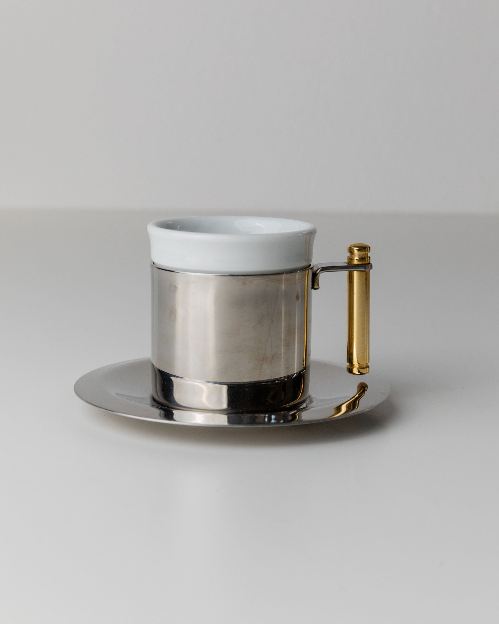 Coffee Set by IMCO, Italy 80s — back view of stainless steel cup with gold handle