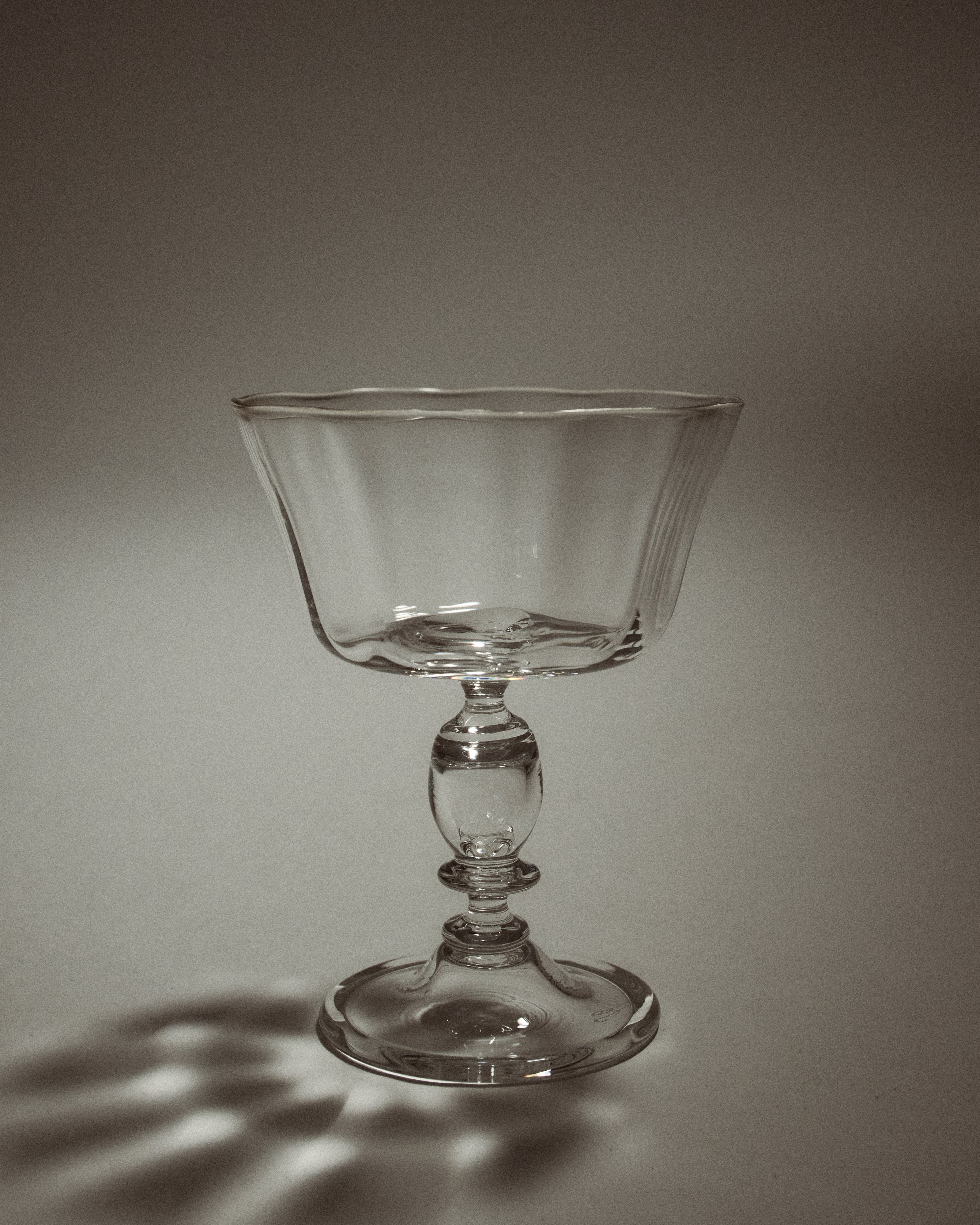 Alban Champagne Glass - Set of Four — side angle showing clear glass design