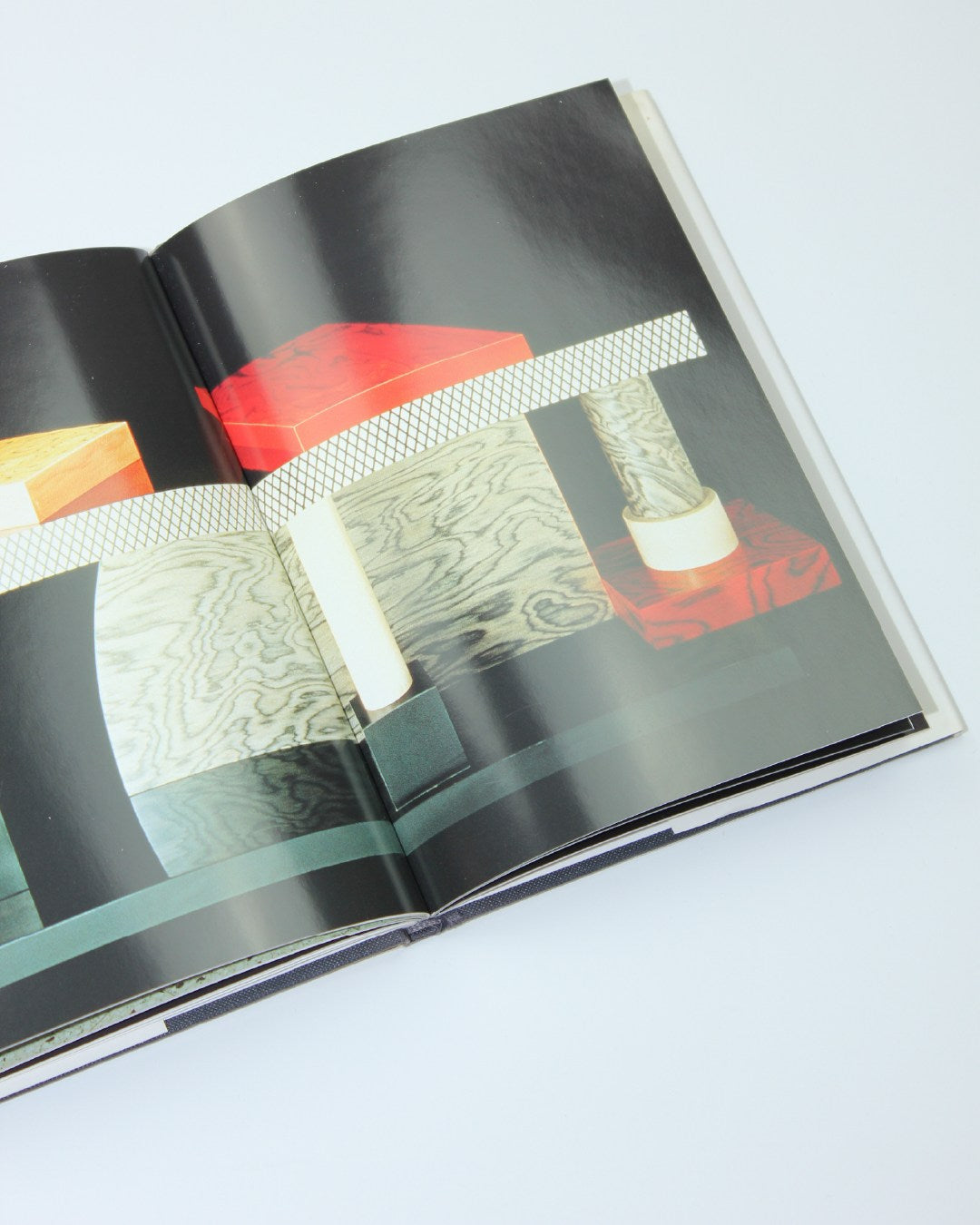 Memphis — side angle of colorful geometric book pages