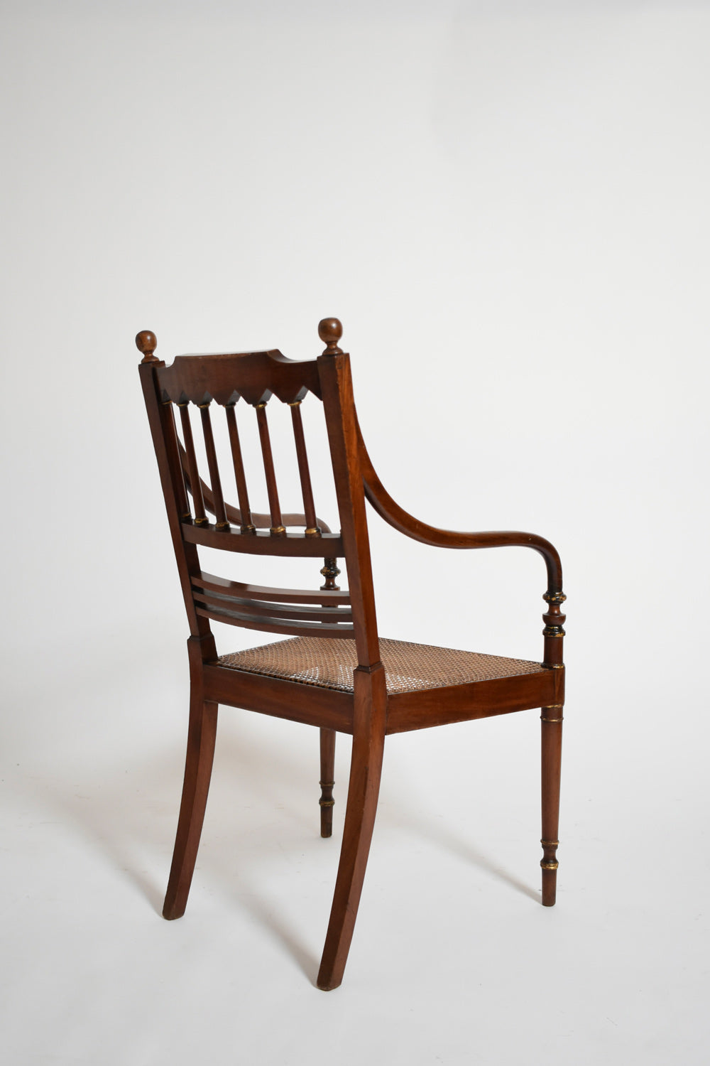 Pair of George III style armchairs, XIXth c. — angled view showing wooden frame and woven seat