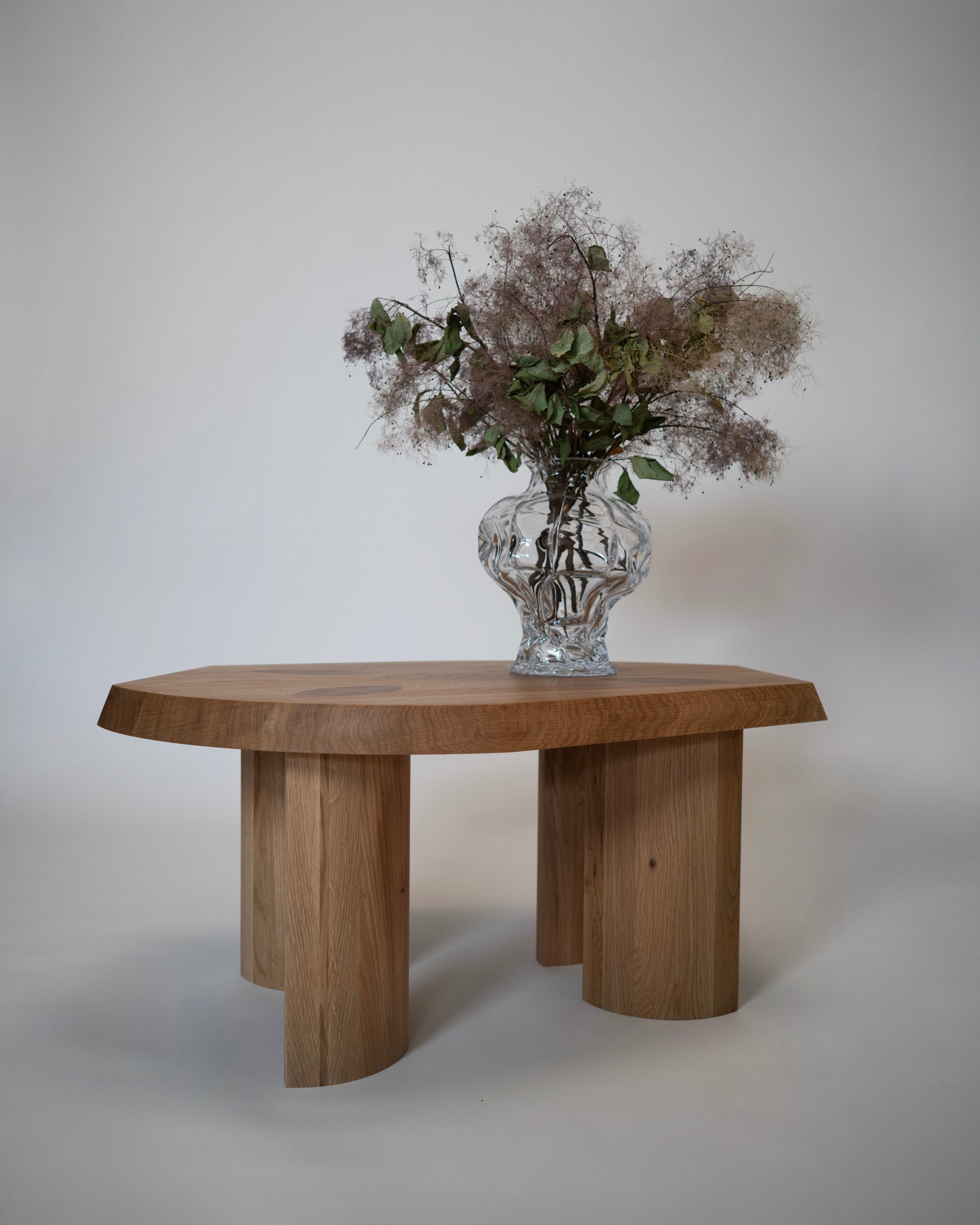 Gilbert Small Coffee Table - Oak — close-up of oak surface with vase and flowers