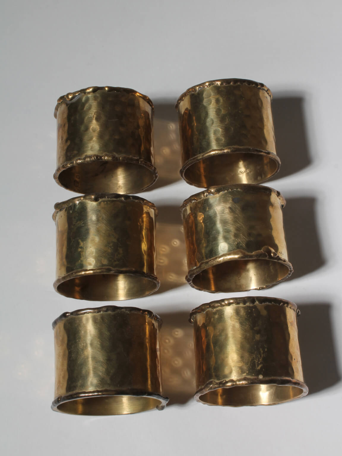 Textured Brass Napkin Rings Set — side angle