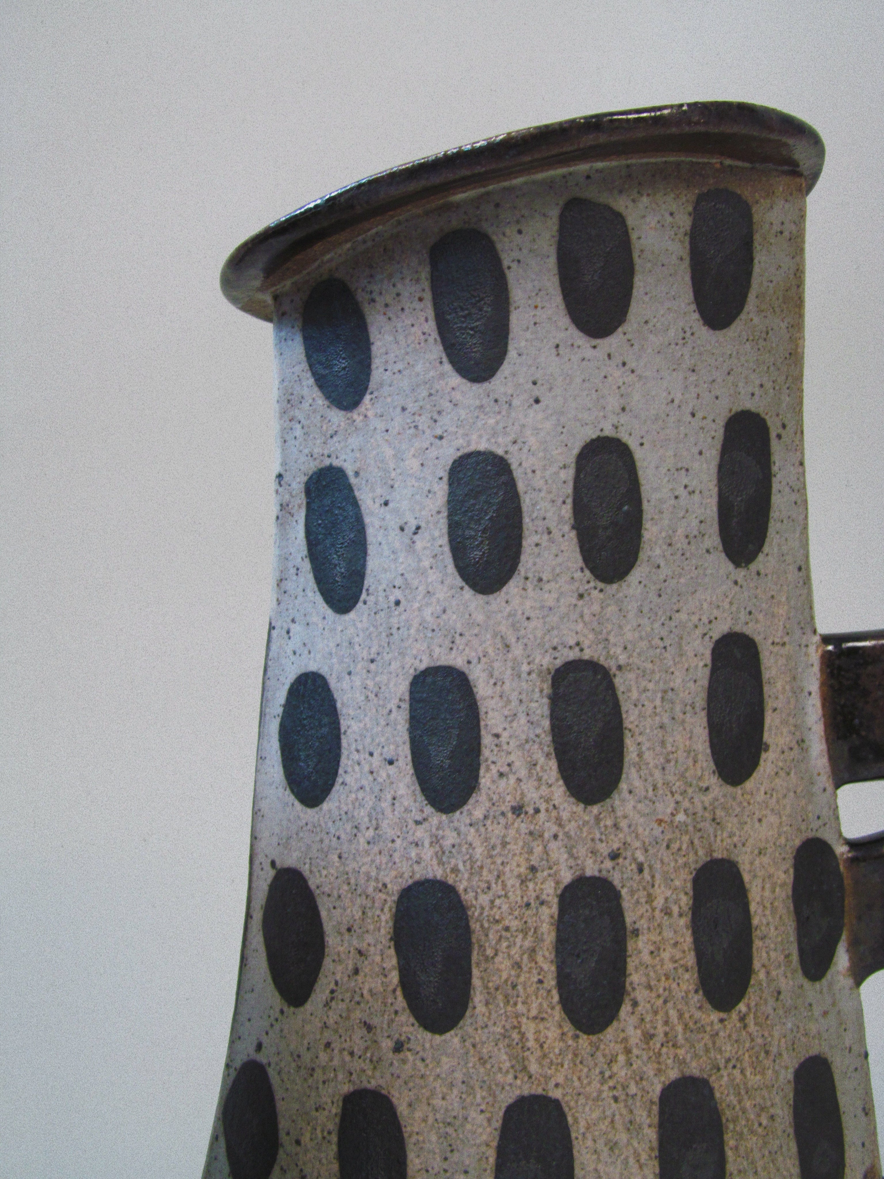 Kazuko Matthews Vases — close-up of textured ceramic with black dots