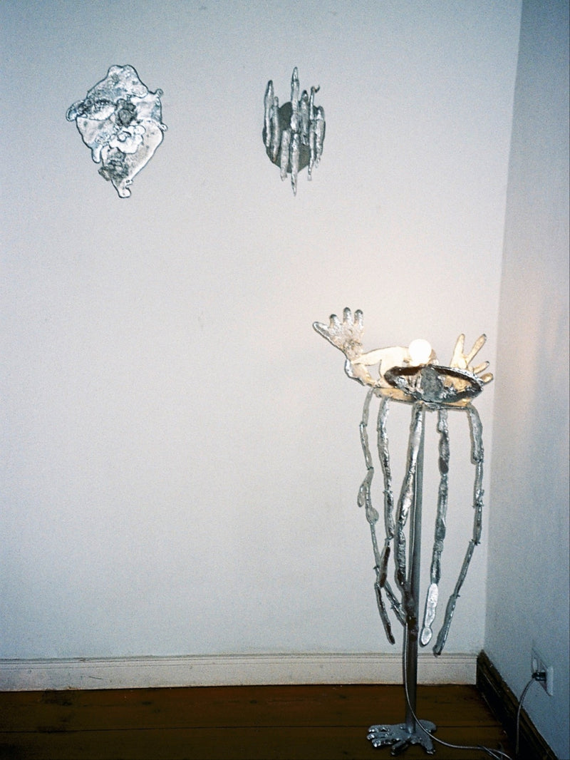 No Body sculptural floor lamp with hand-shaped light fixture