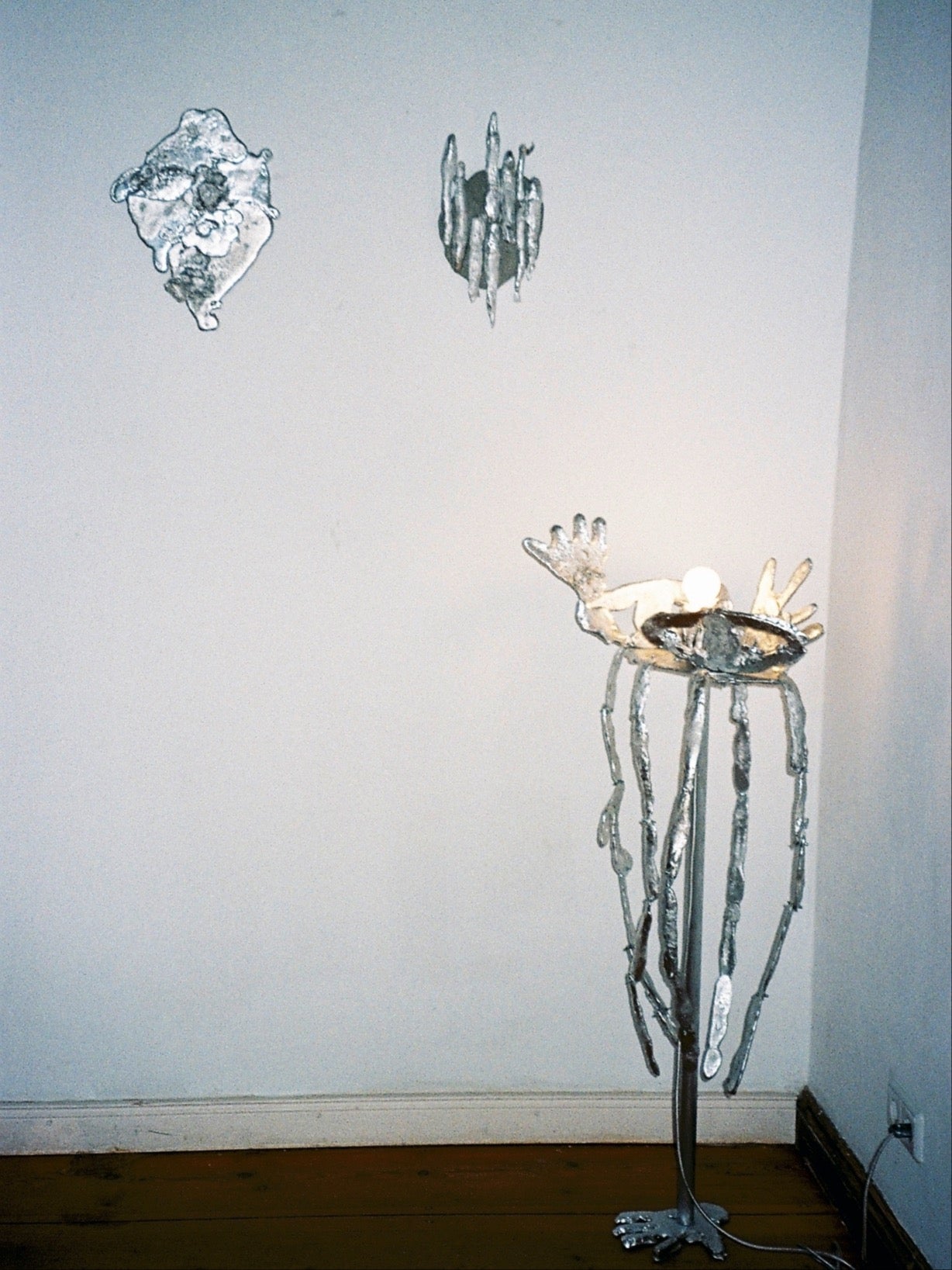 No Body sculptural floor lamp with hand-shaped light fixture