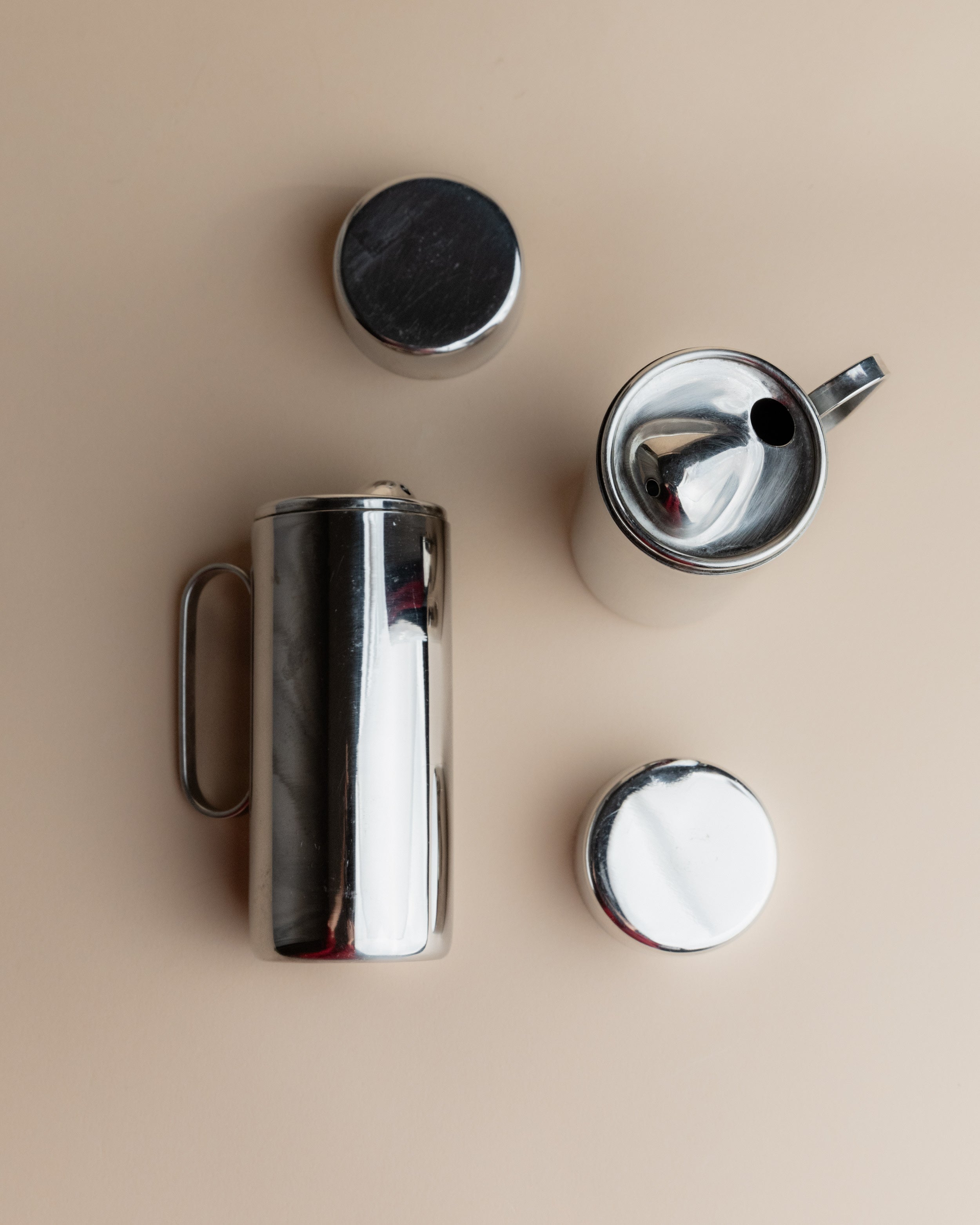 Disassembled 1980s stainless steel oil vinegar set components