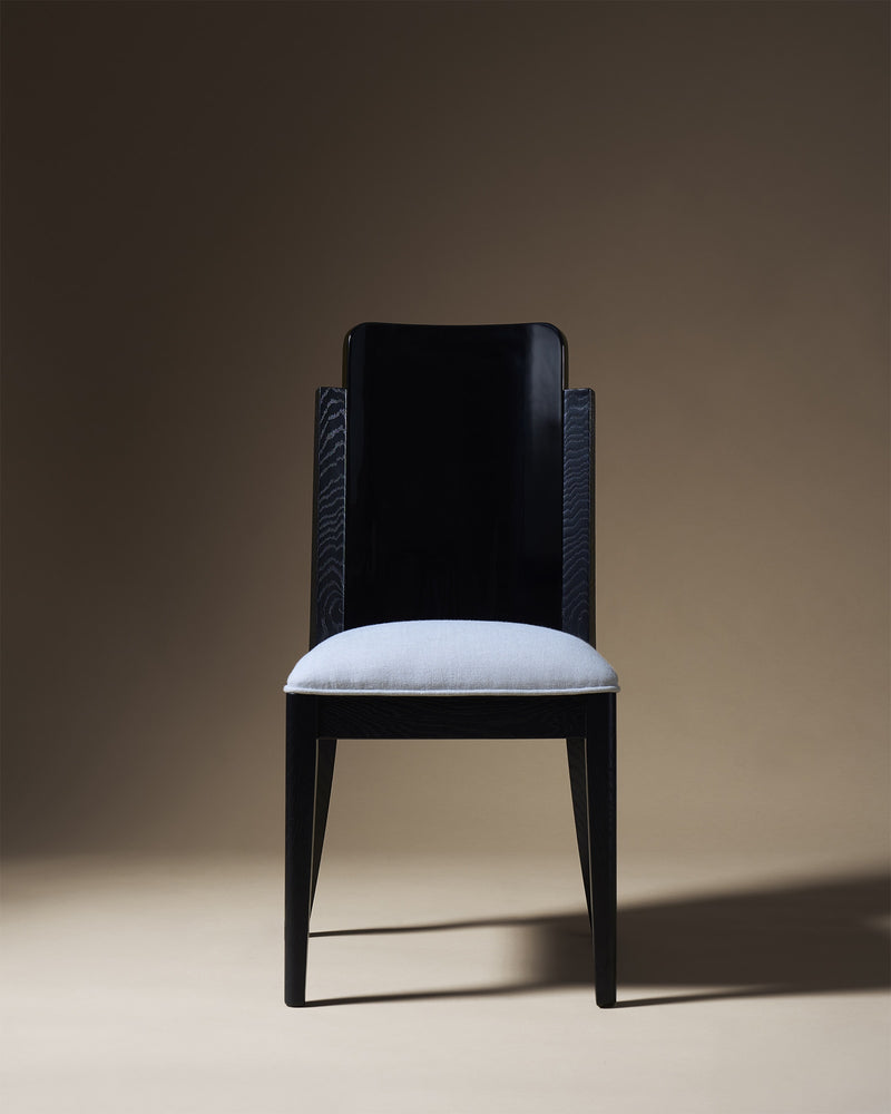 Opera dining chair with dark wood frame and light upholstered seat