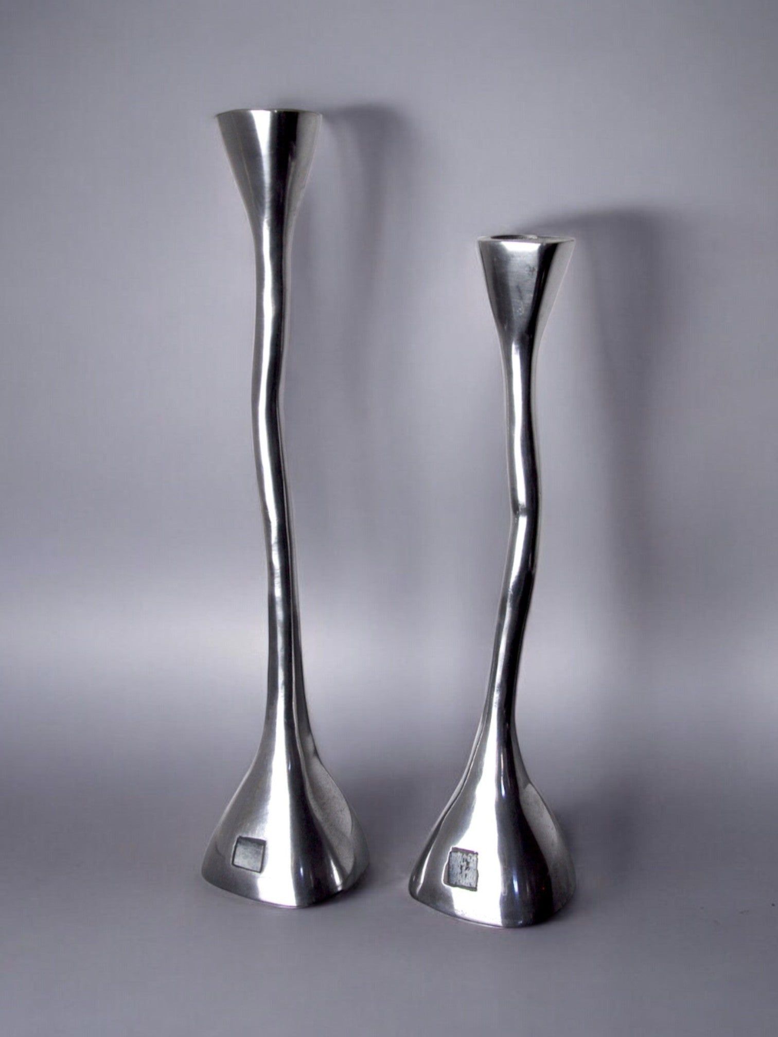 Pair of Candleholders, art3, Spain, 1970s — close-up of polished metal finish