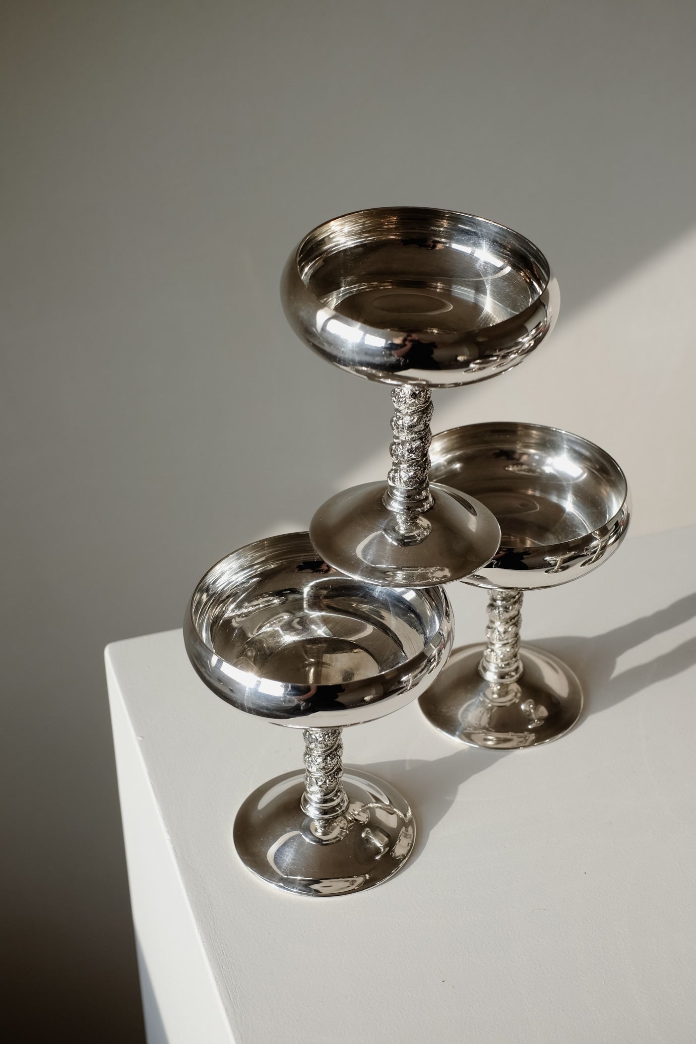 Set of 6 Silver Coupes — top view of polished silver cups stacked