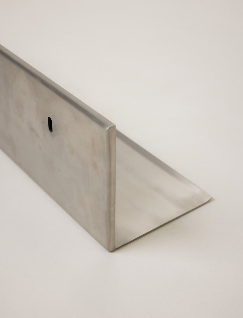 Mirror Steel Shelf — close-up of brushed stainless steel edge