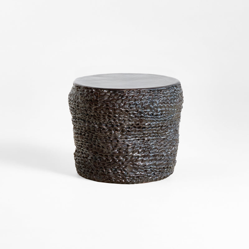 Casa Ceramic Side Table — close-up of textured dark ceramic surface