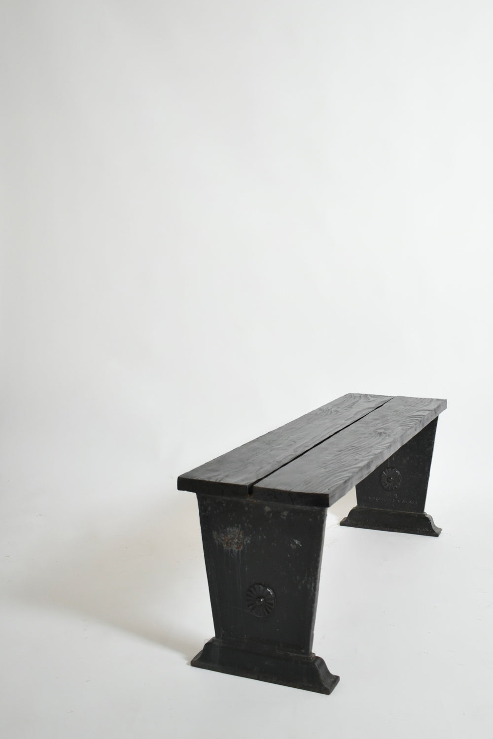 Skoglund & Olson Cast Iron Bench, 1920s — side angle showing black cast iron legs
