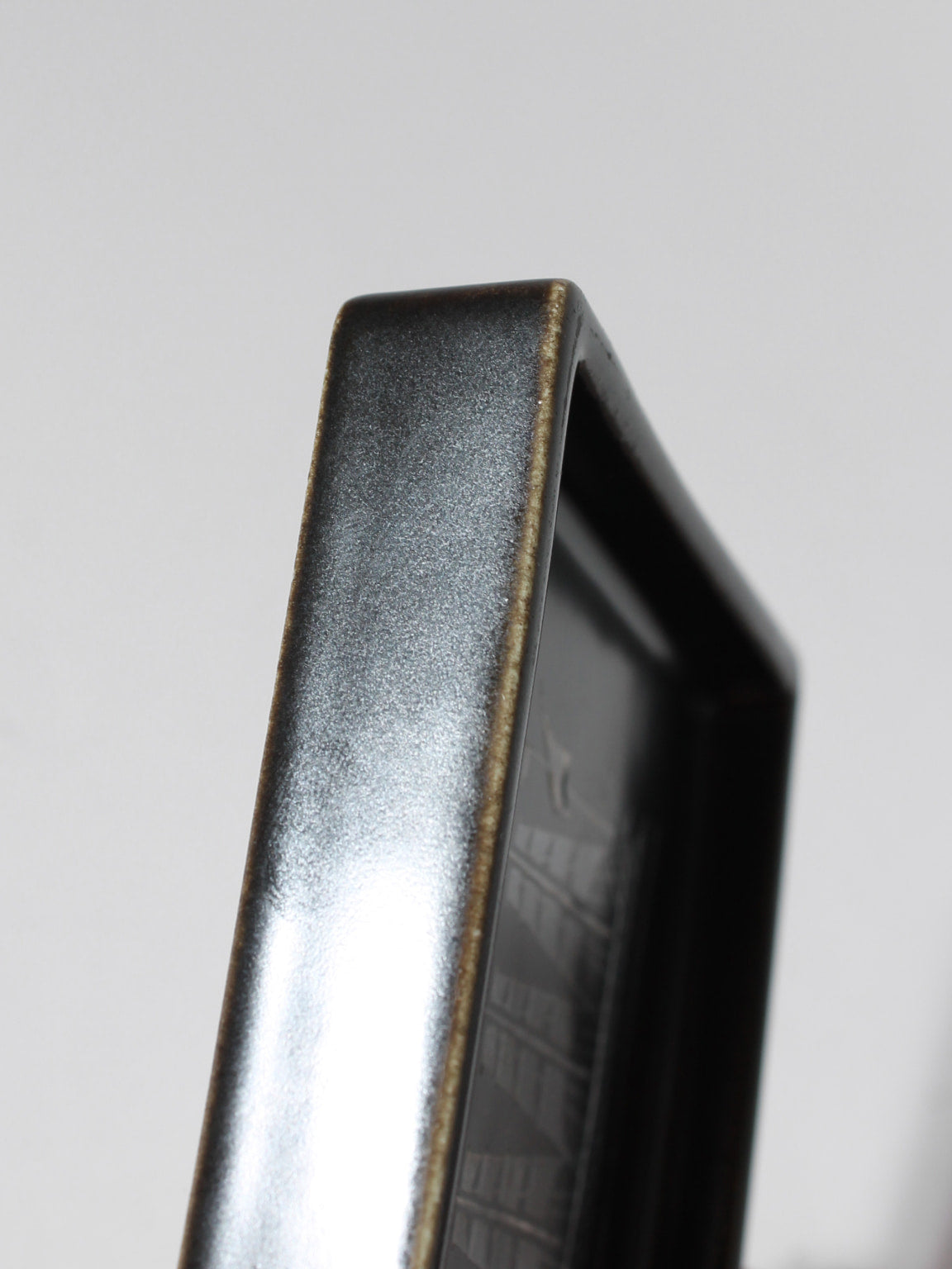 Sven Jonson "Facett" Ceramic Ashtray, For Gustavsberg, 1960s — angled view highlighting glossy black finish