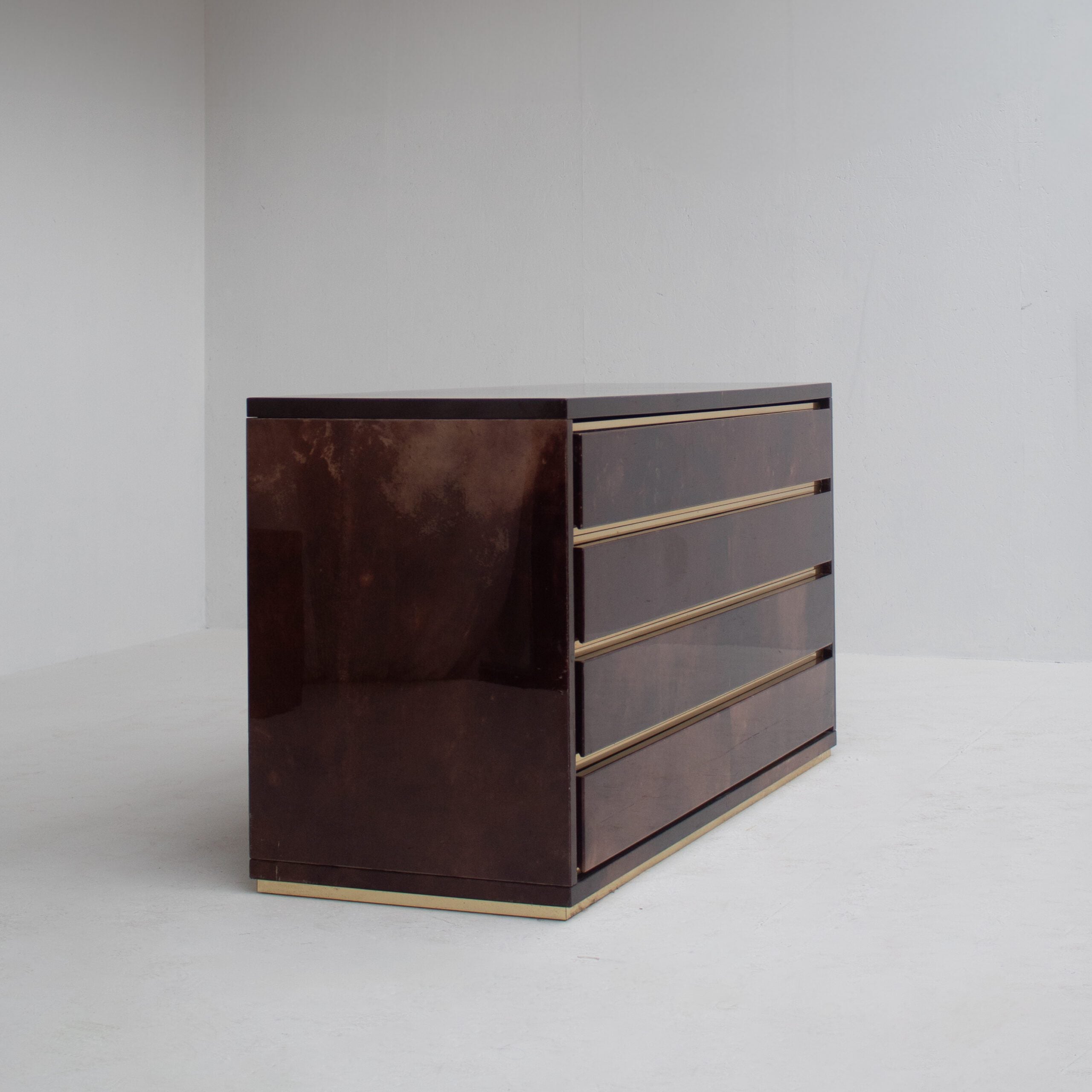 Aldo Tura Cabinet in Brown Lacquer with Brass Details — angled view showing four drawers
