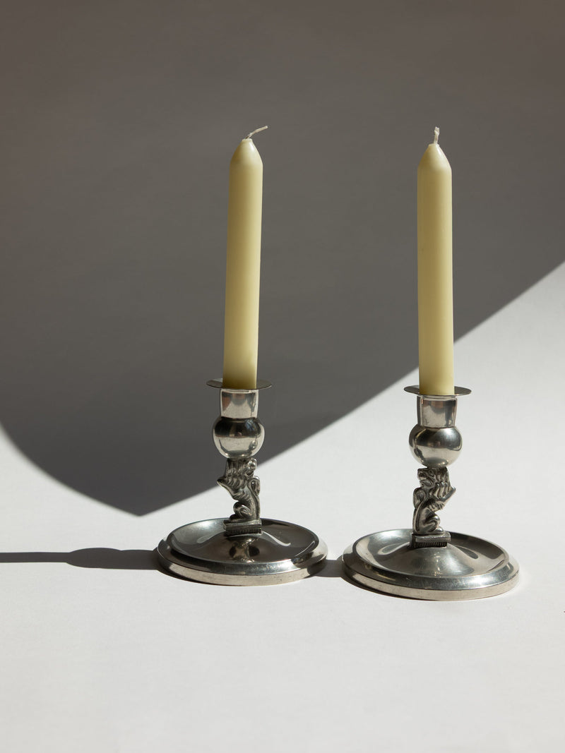 Pair of Swedish Grace Art Deco Pewter Lion Candlesticks by Eskilstuna Metallindustri, 1932 — side angle