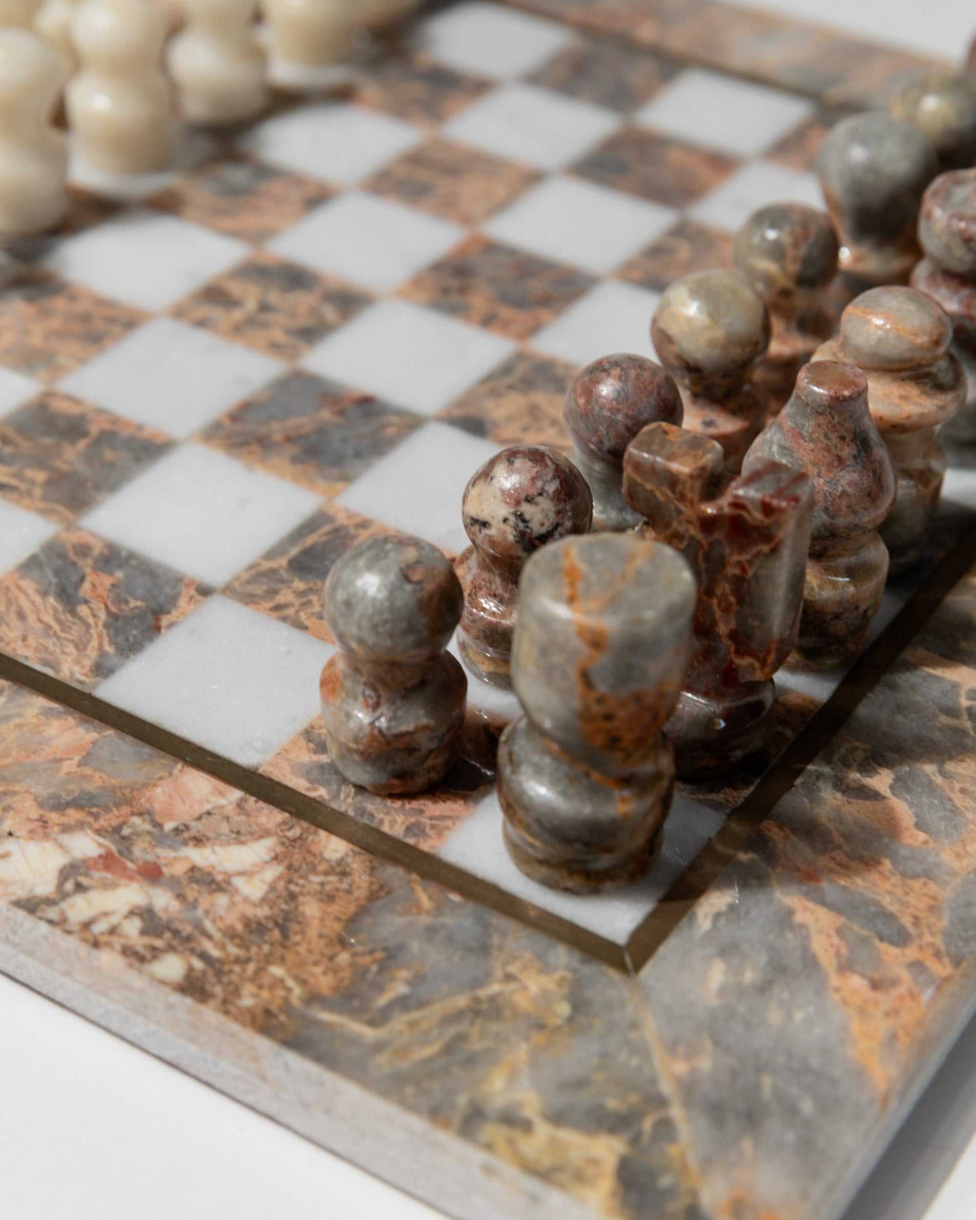 Vintage marble chess pieces detail on checkered board Italy 1960s