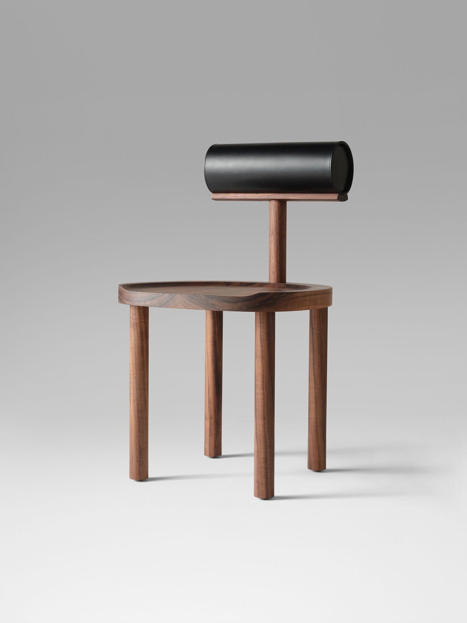 UNA Chair by Estudio Persona — back view highlighting walnut wood and cylindrical backrest