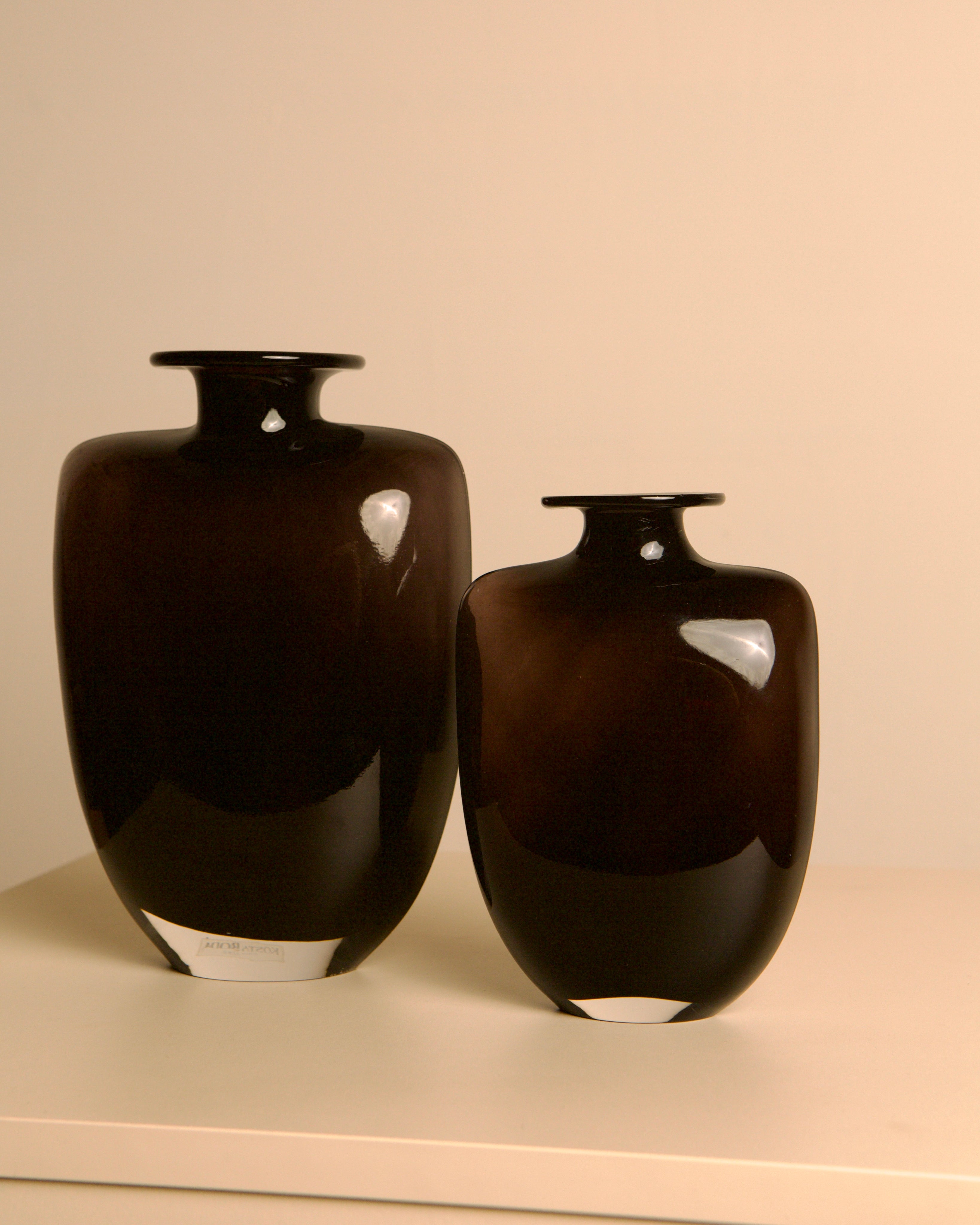 Pair of dark glass vases, Kjell Engman for Kosta Boda, Sweden, 1980s — side angle