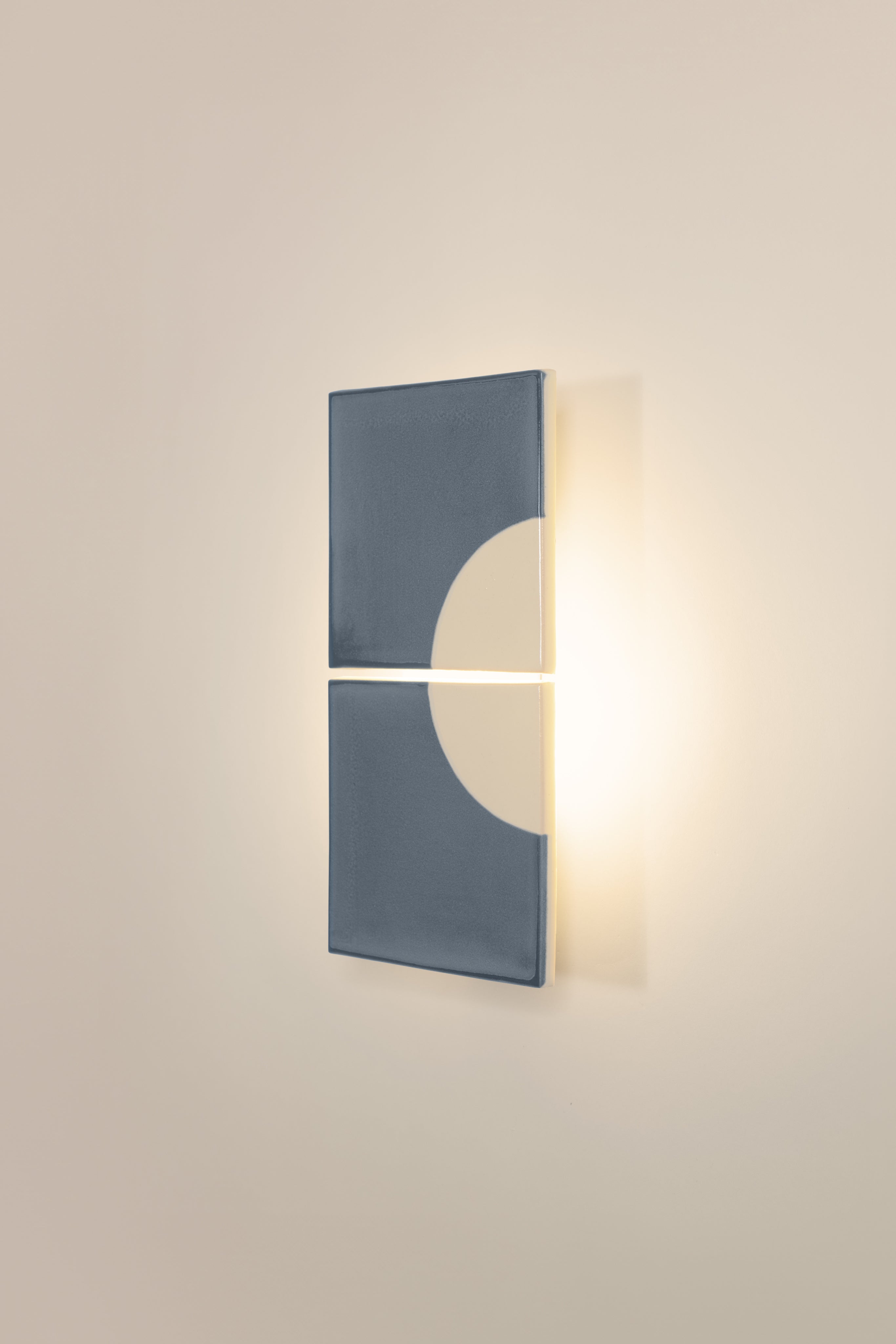 Tiles Moon B — close-up of gray ceramic wall lamp on neutral wall