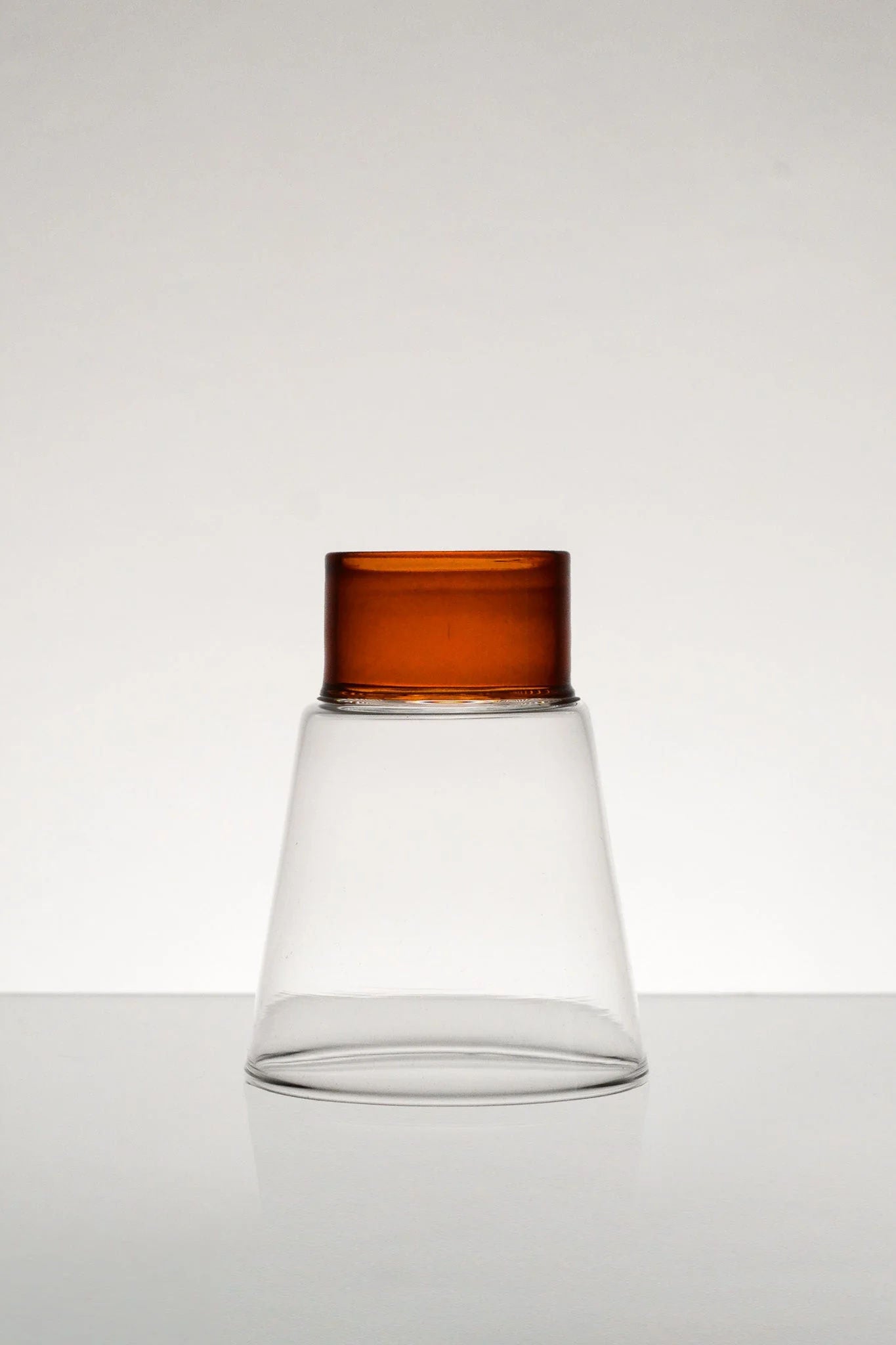 Podio' Glass - Amber — close-up of glass with amber top