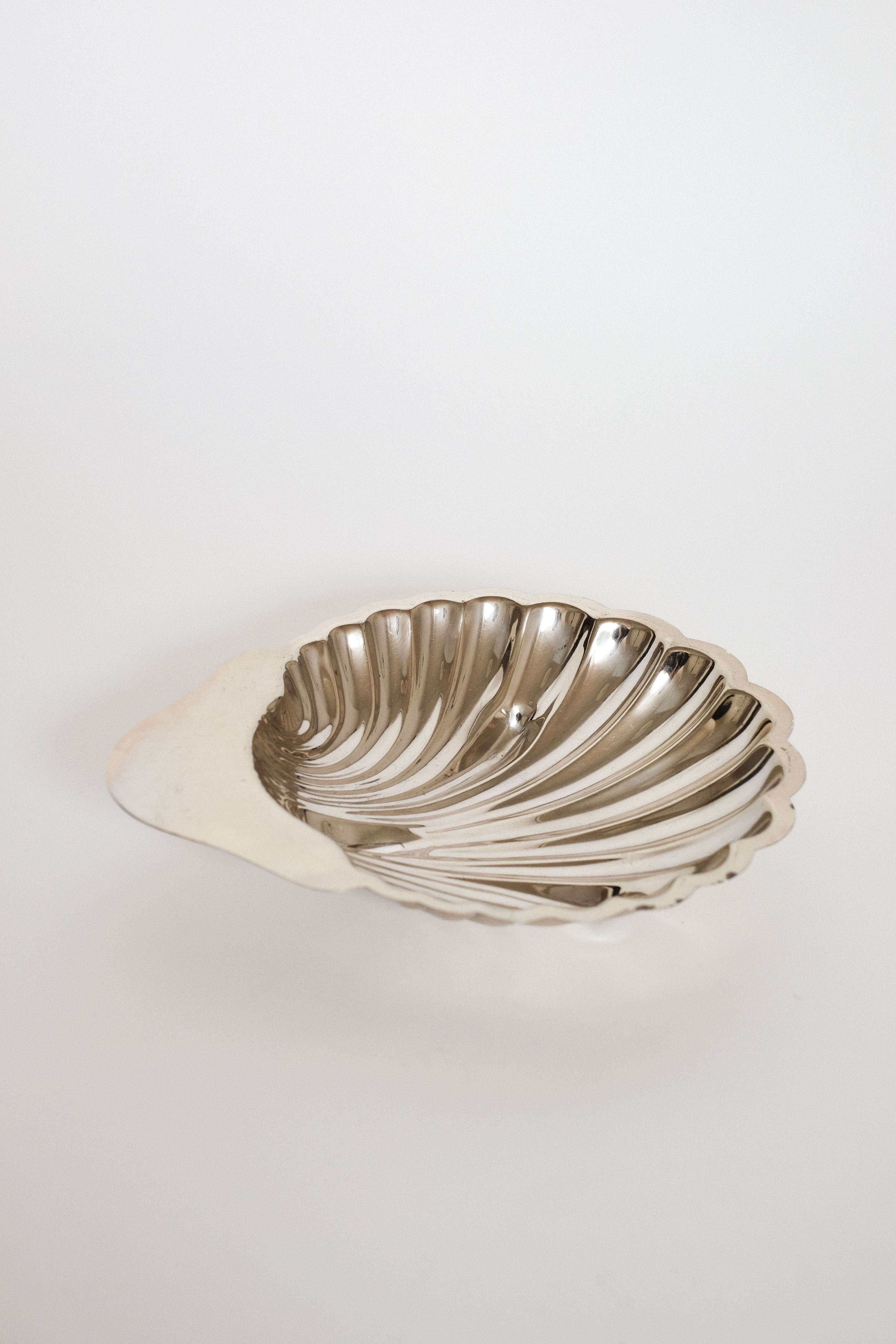 Medium Shell Shaped Vide-poches — top view of polished metal dish