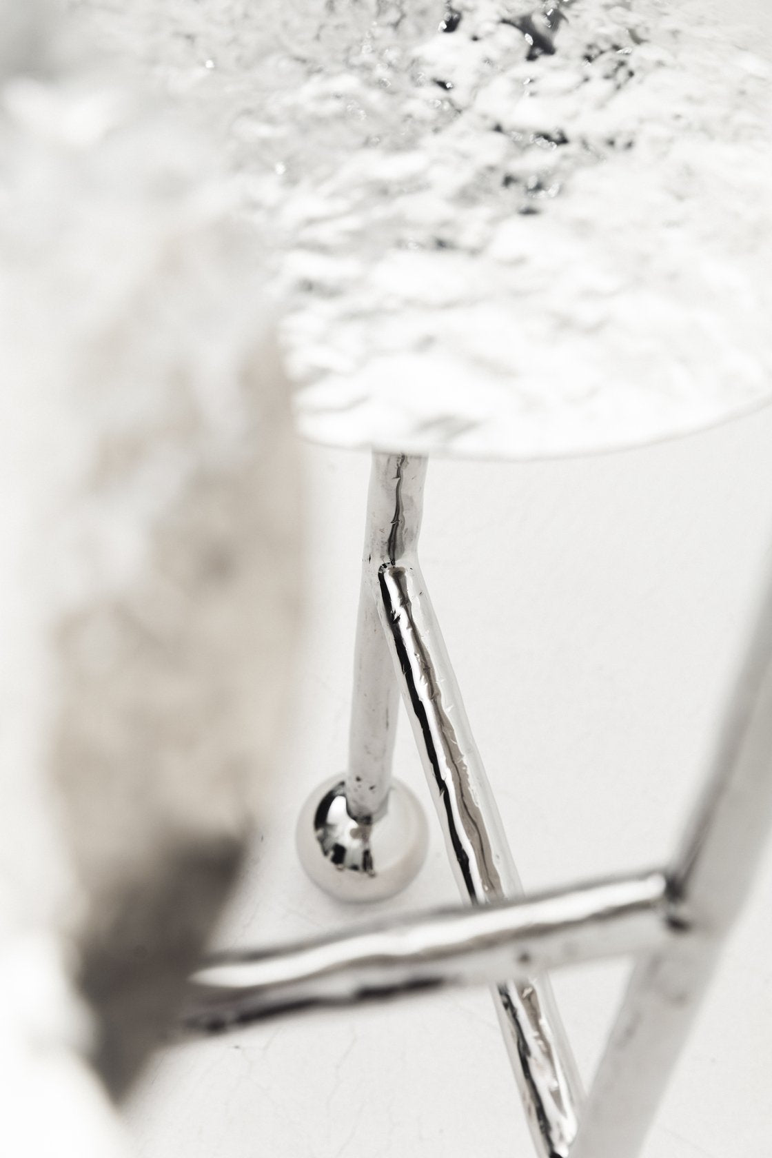 Liquid Side Table Stainless Steel — close-up