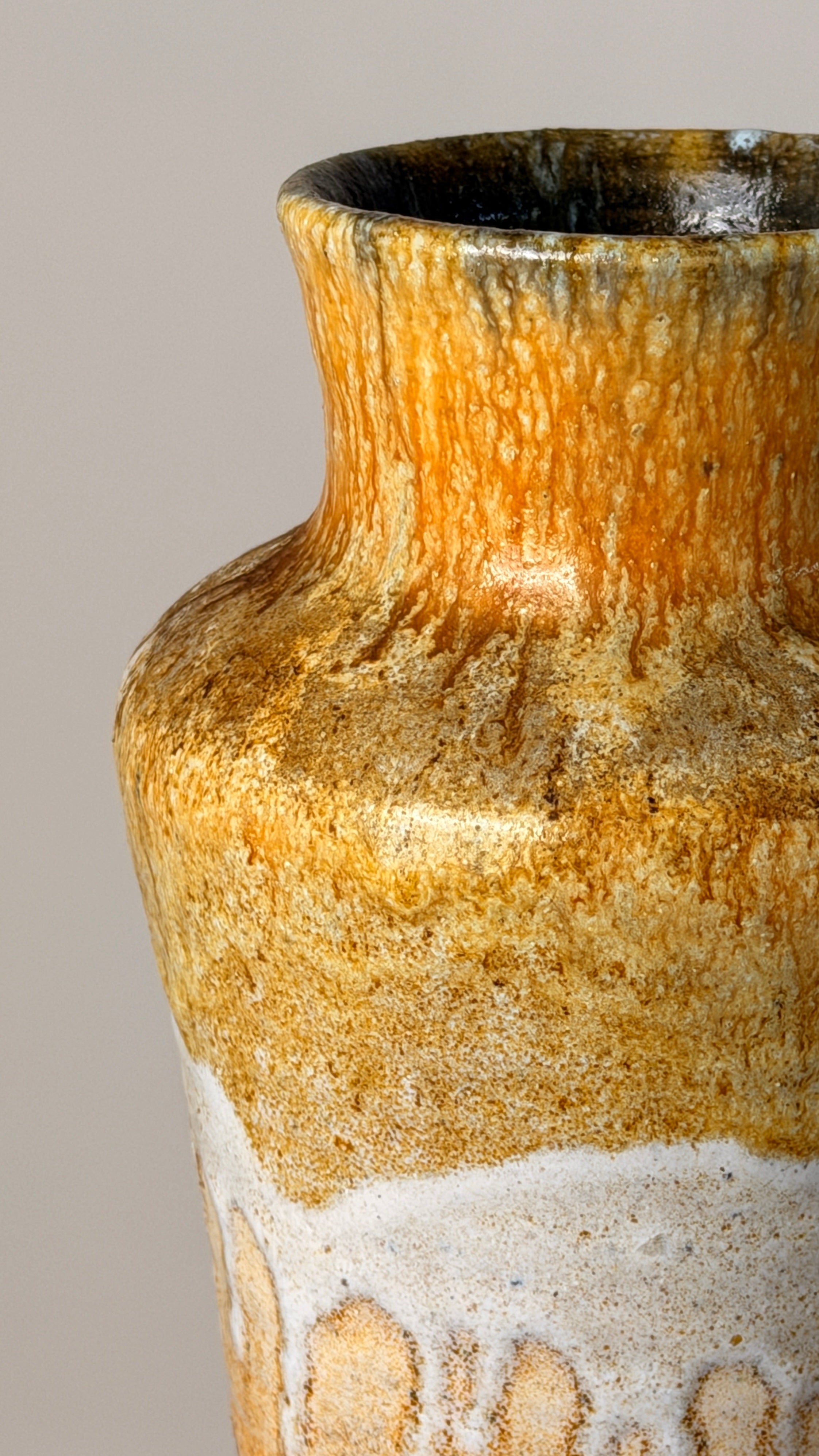 Ceramic Vase, France, circa 1960 — close-up of textured orange glaze