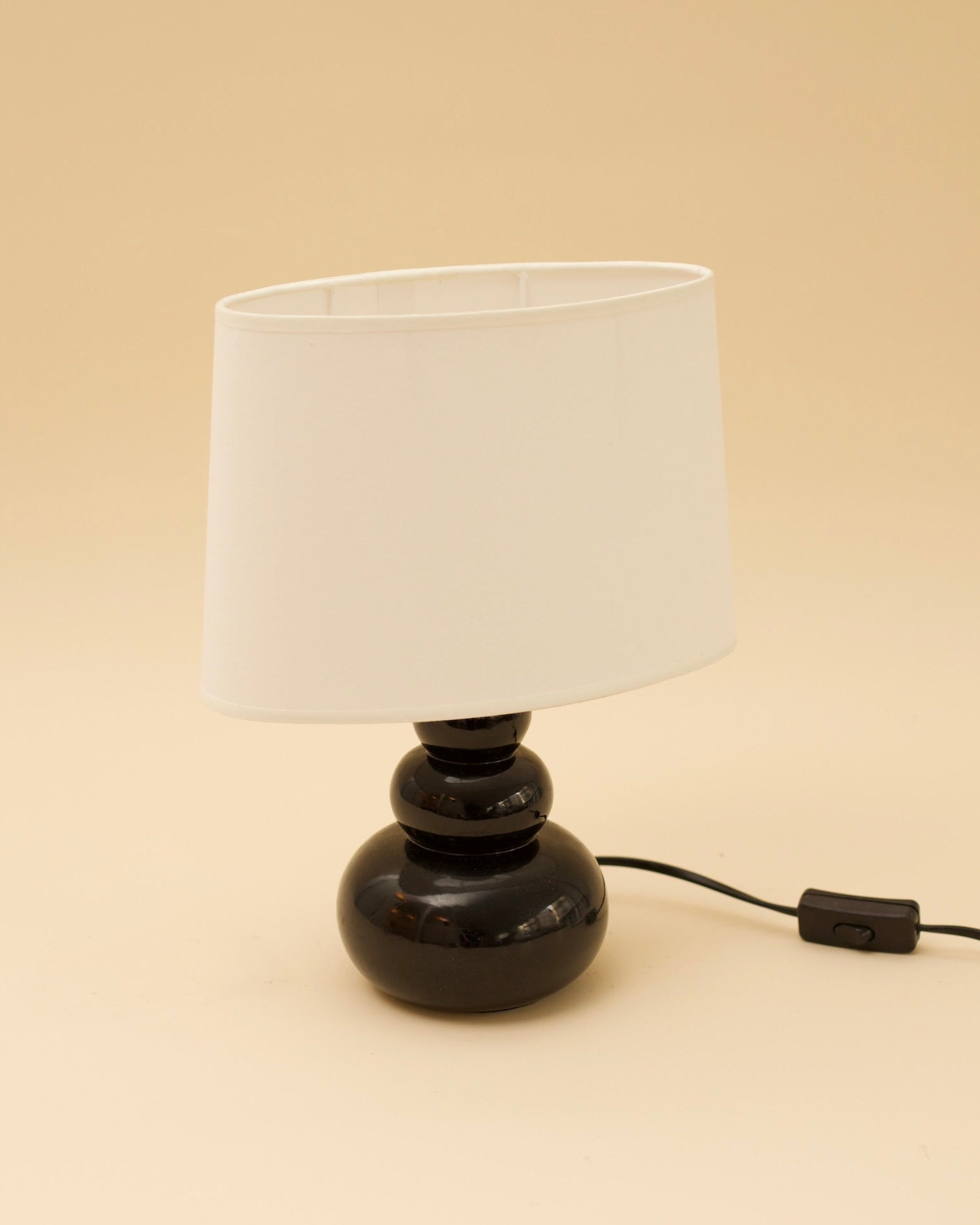 OTTO Table Lamp — close-up of black ceramic base with white shade