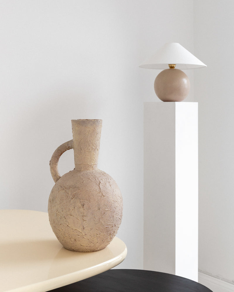 Spherical Modernist Ceramic Table Lamp, 1940s, Sweden — positioned on white pedestal with ceramic vase
