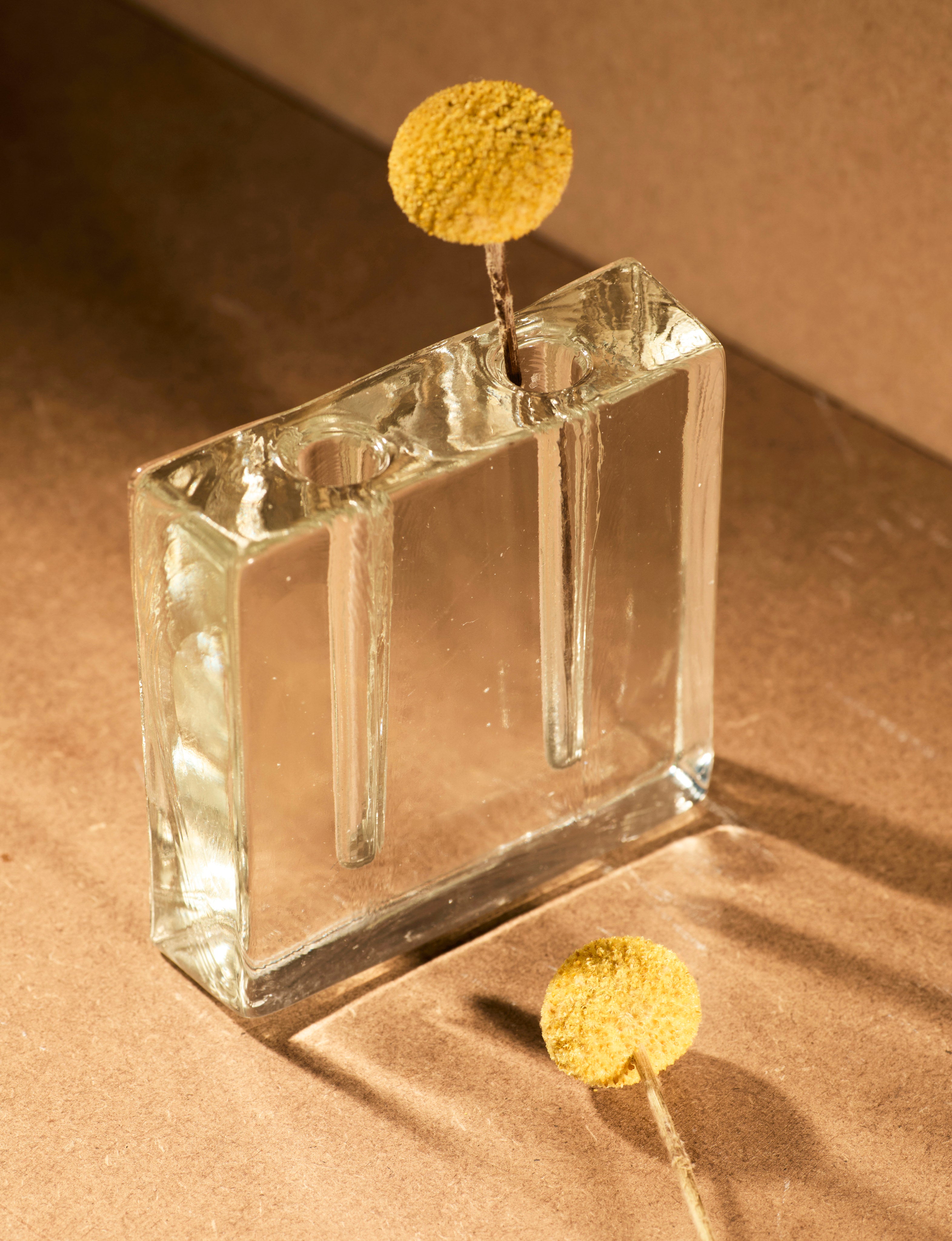 Vintage Scandinavian Clear Vase in Glass c. 1960 — angled view with yellow flowers