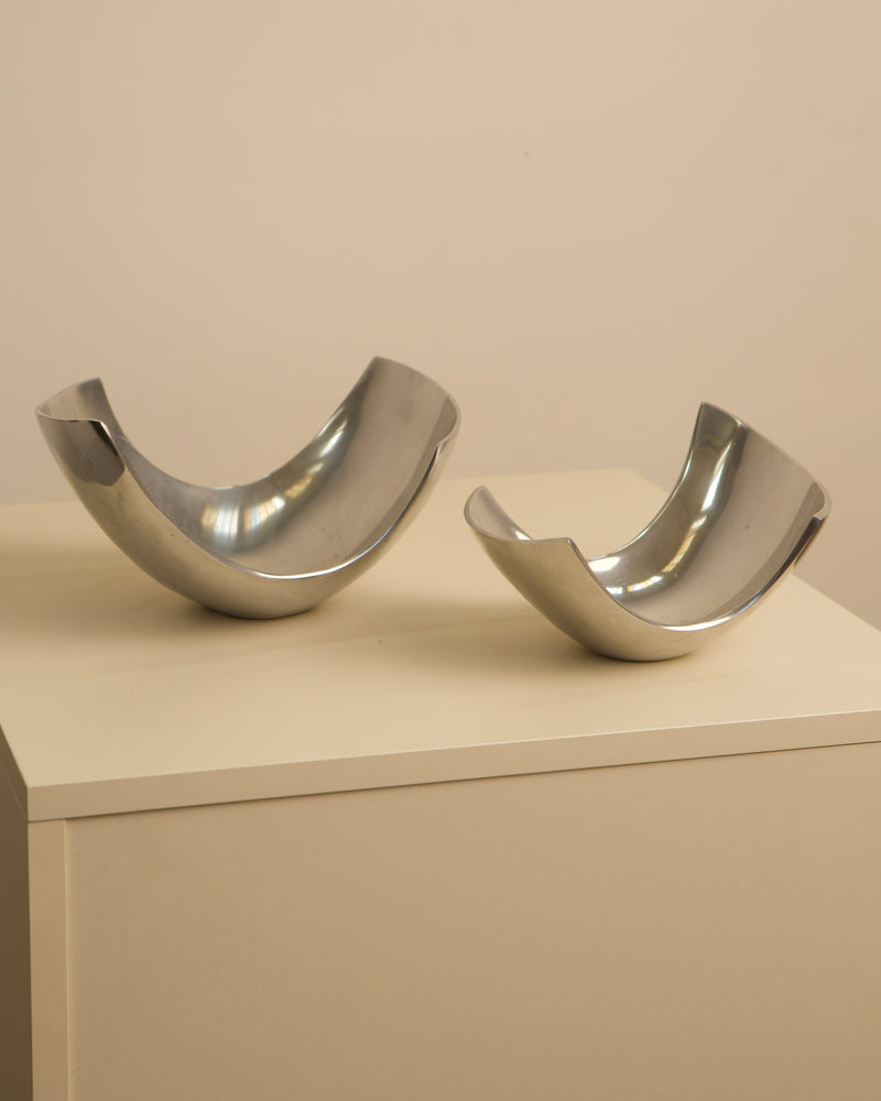Polished steel Italian fruit baskets pair displayed on pedestal